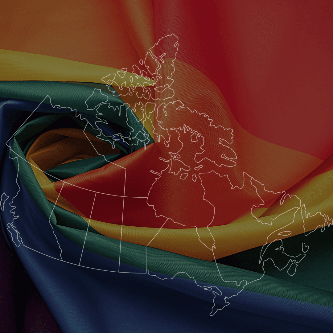 Close-up of a vibrant rainbow flag with flowing colors of red, orange, yellow, green, blue, and purple.