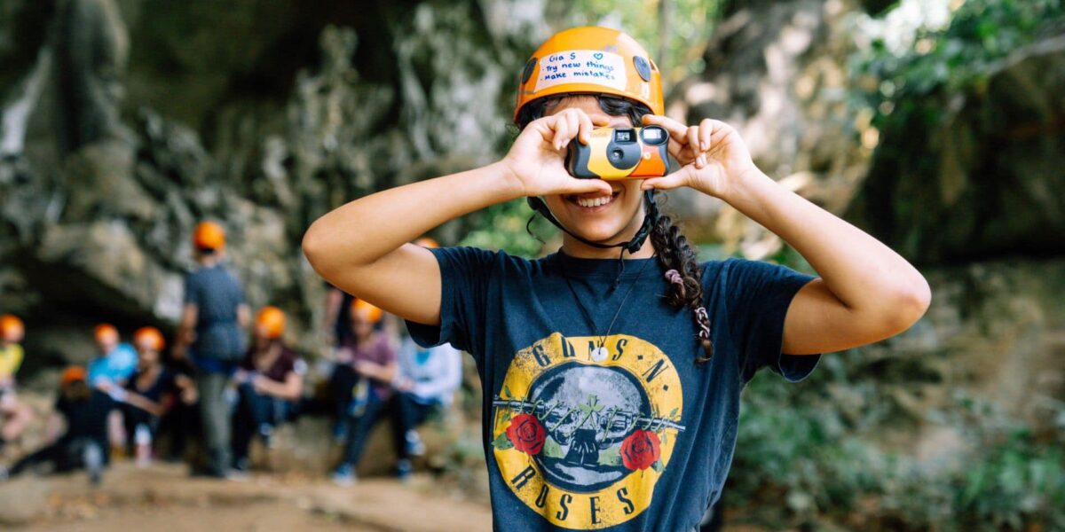 Girl creator clicking photo on camp