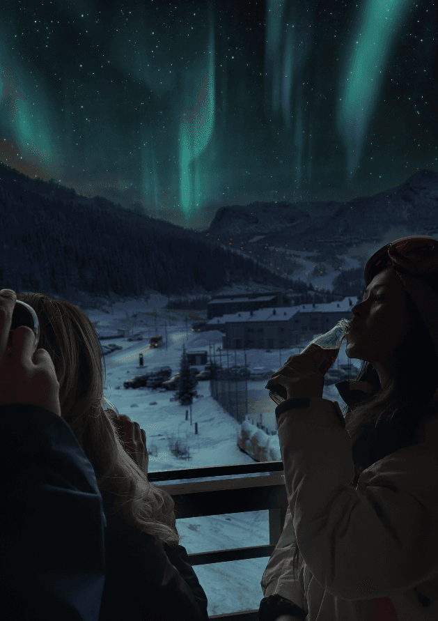 A mixed-reality mockup of people on a balcony drinking Coke under a green aurora