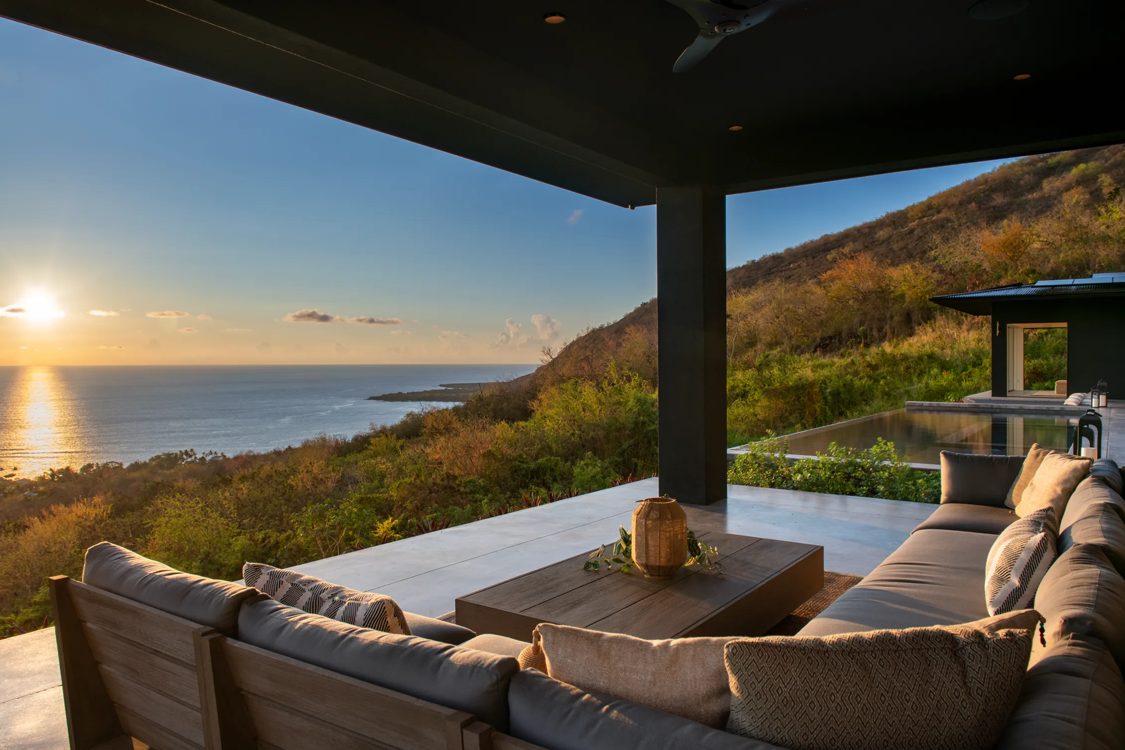 Covered lanai overlooking an ocean sunset, South Kona