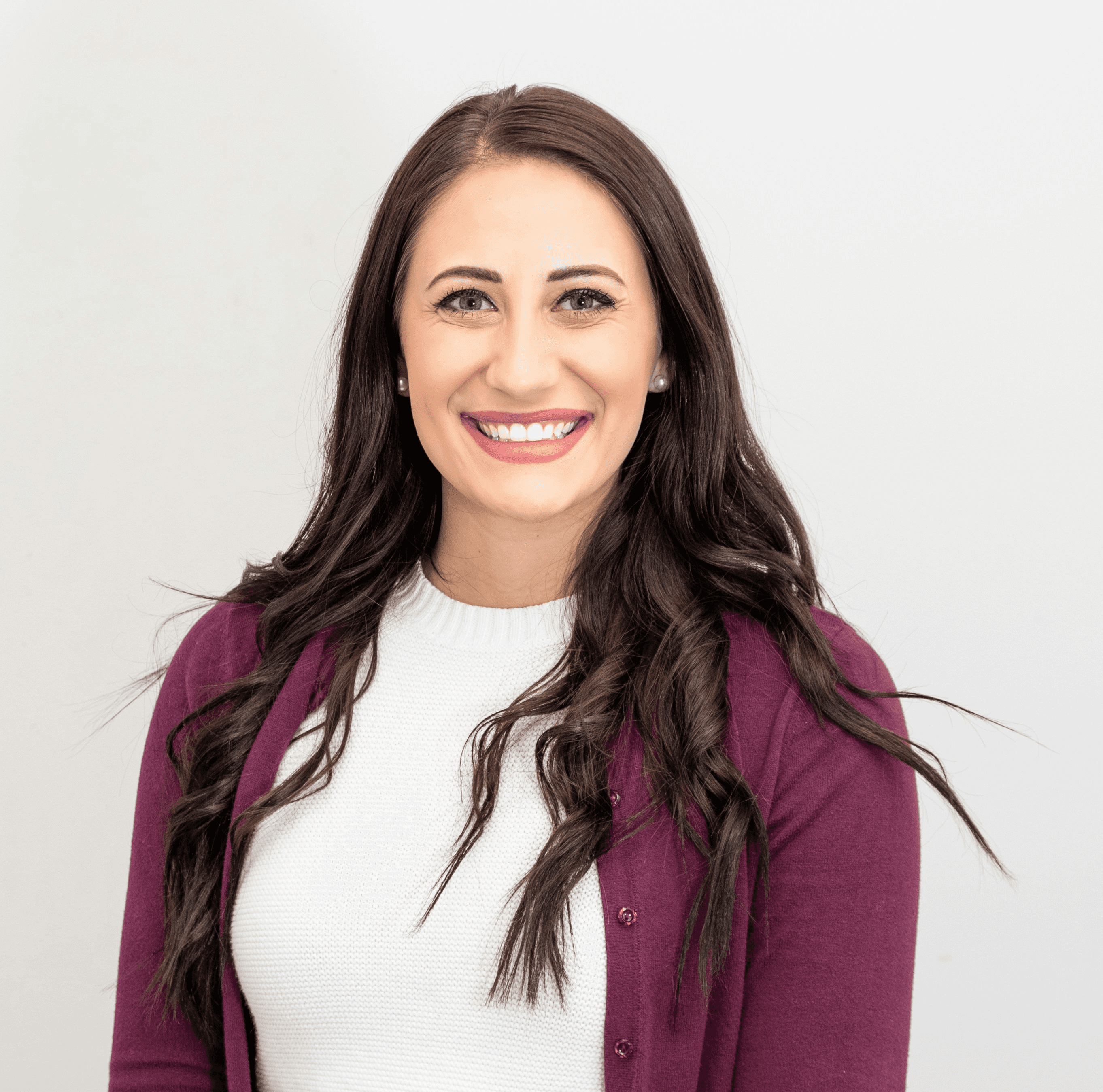 woman in red cardigan smiling