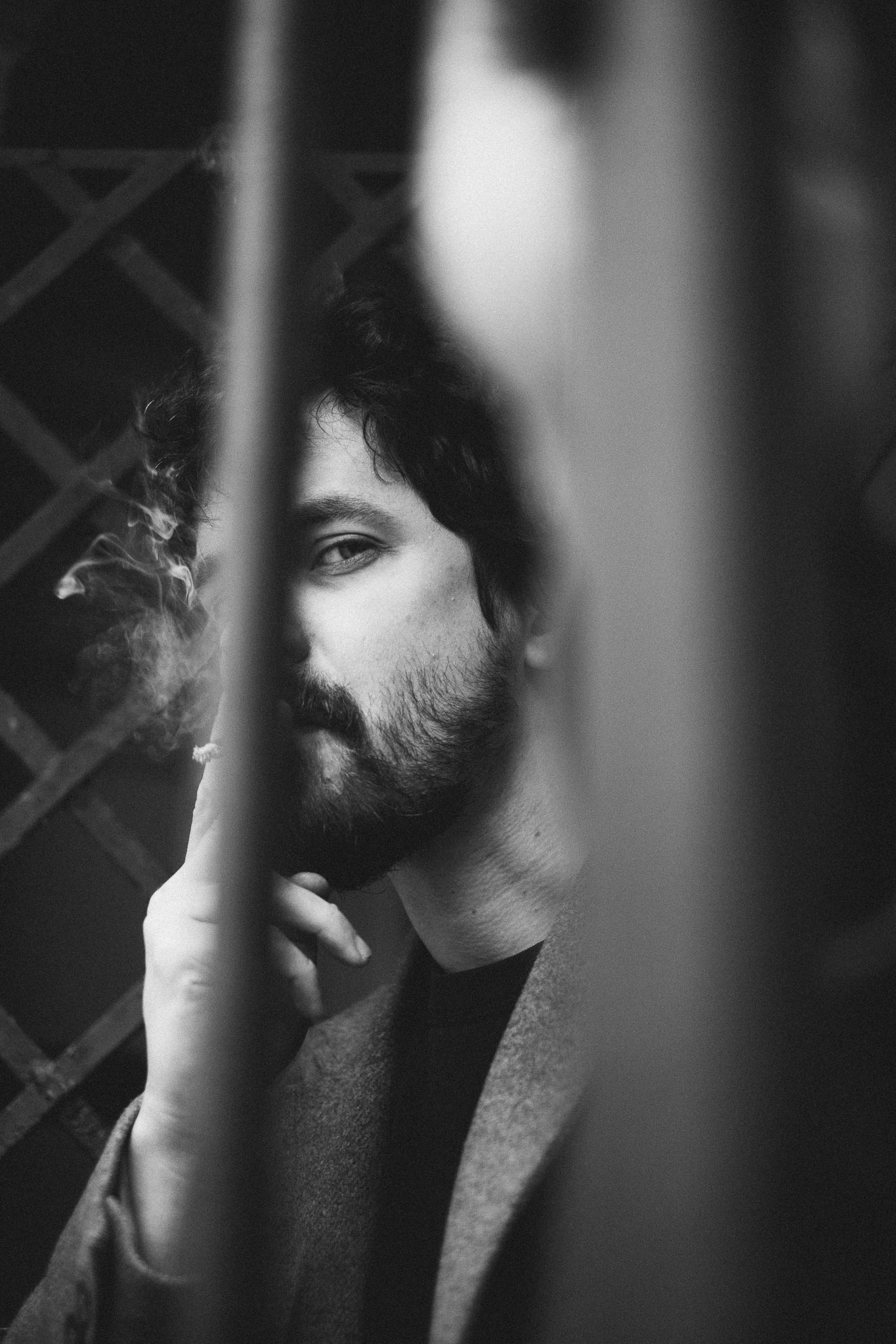 Stylish individual with platinum blonde hair, sunglasses, and leather outfit