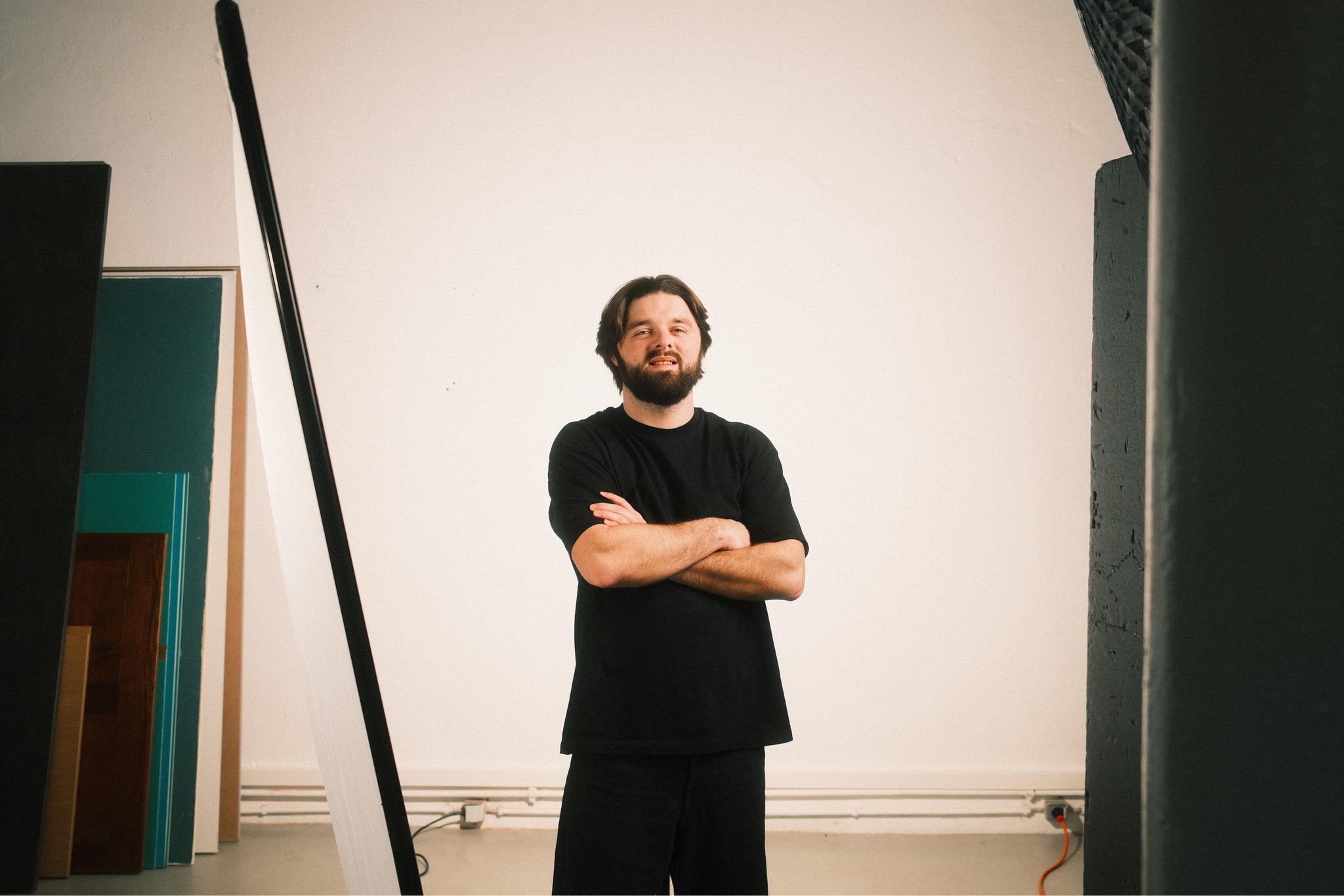 a blurry photo of a person standing in front of a wall
