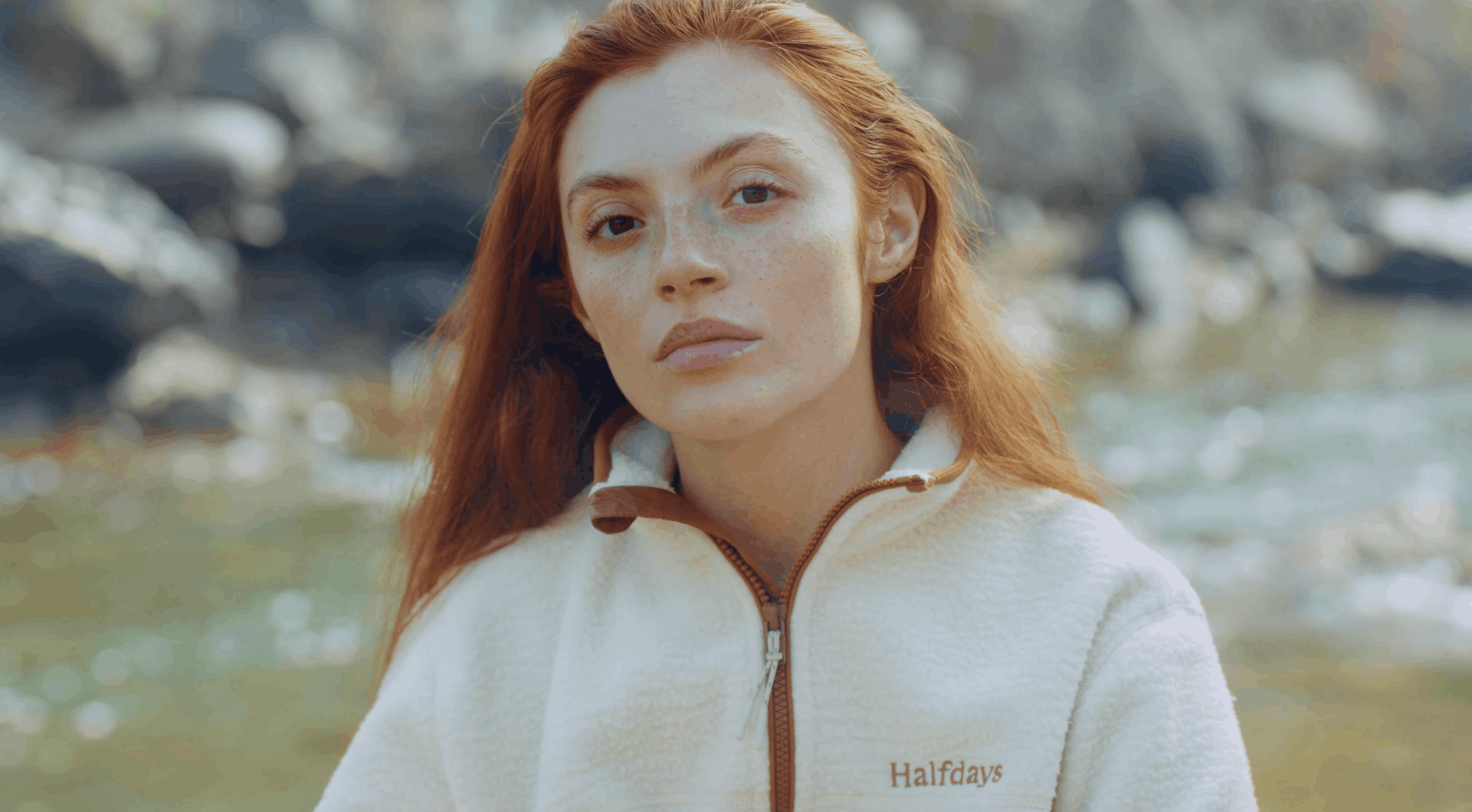 portrait of model wearing halfdays fleece in a colorado mountain setting