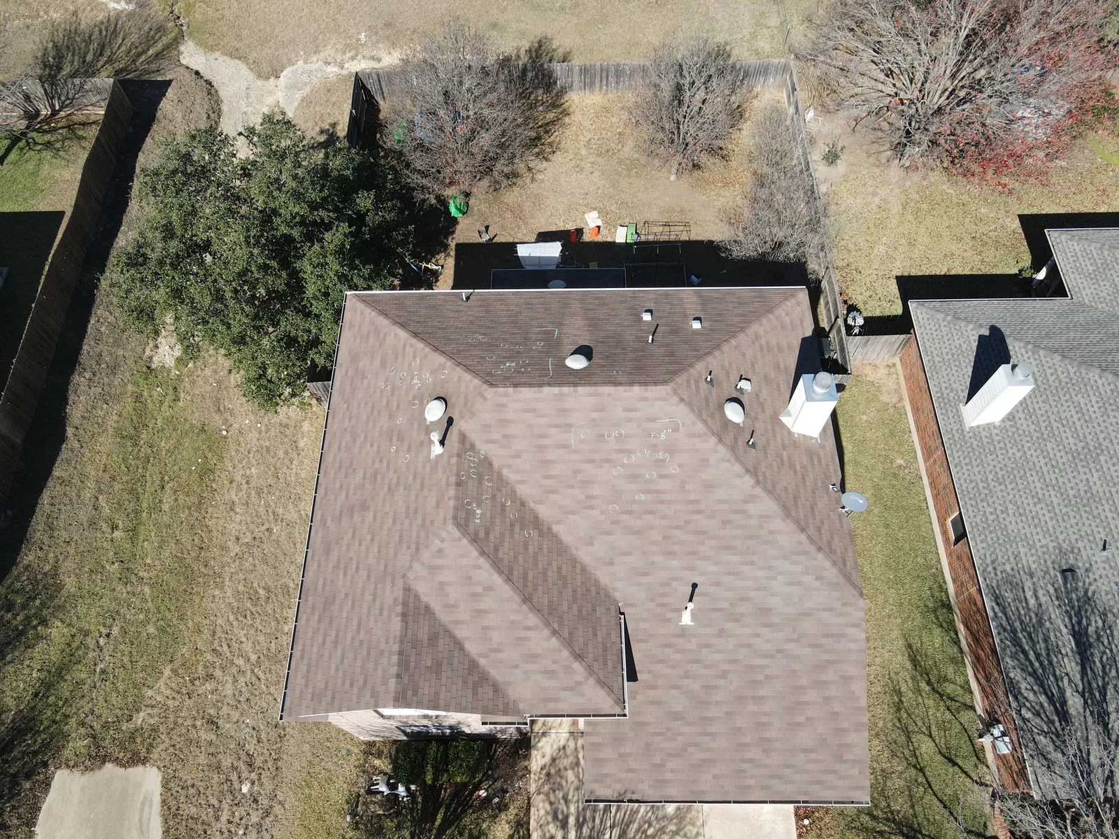 Before replacement: earlier roofing on the same home.