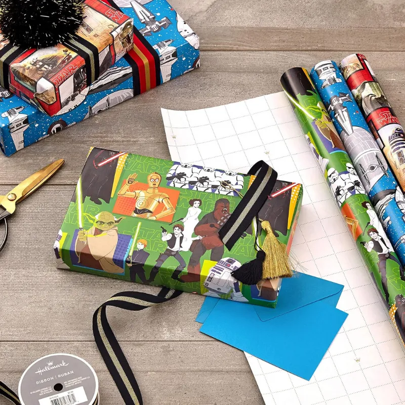 Star Wars-themed wrapping paper in three designs.