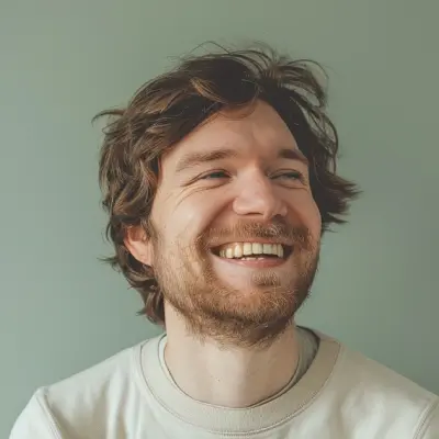 Bearded man smiling, natural light, landscaping client testimonial portrait