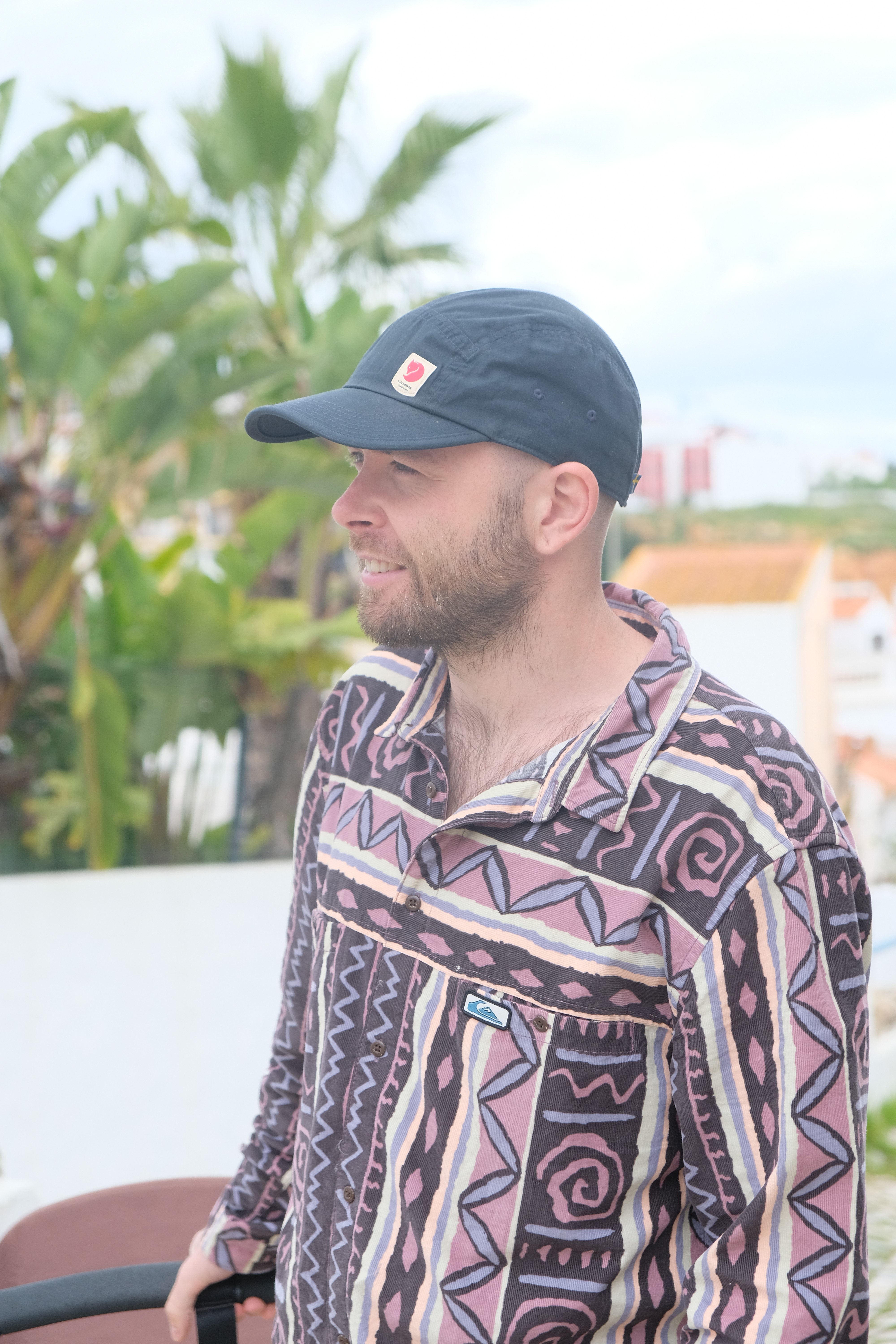 Visual designer in a minimalist studio with an iPad