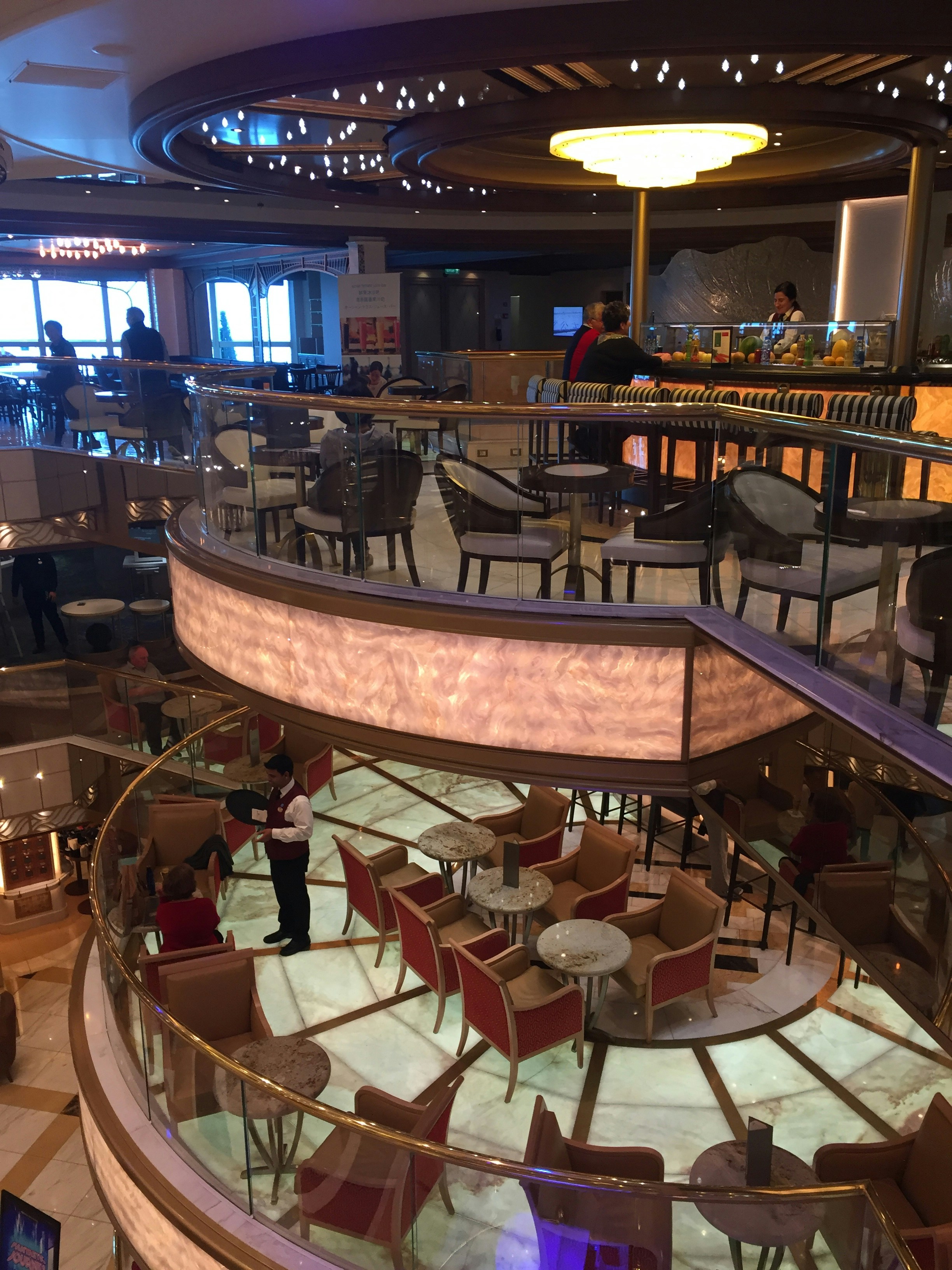 a restaurant filled with lots of tables and chairs