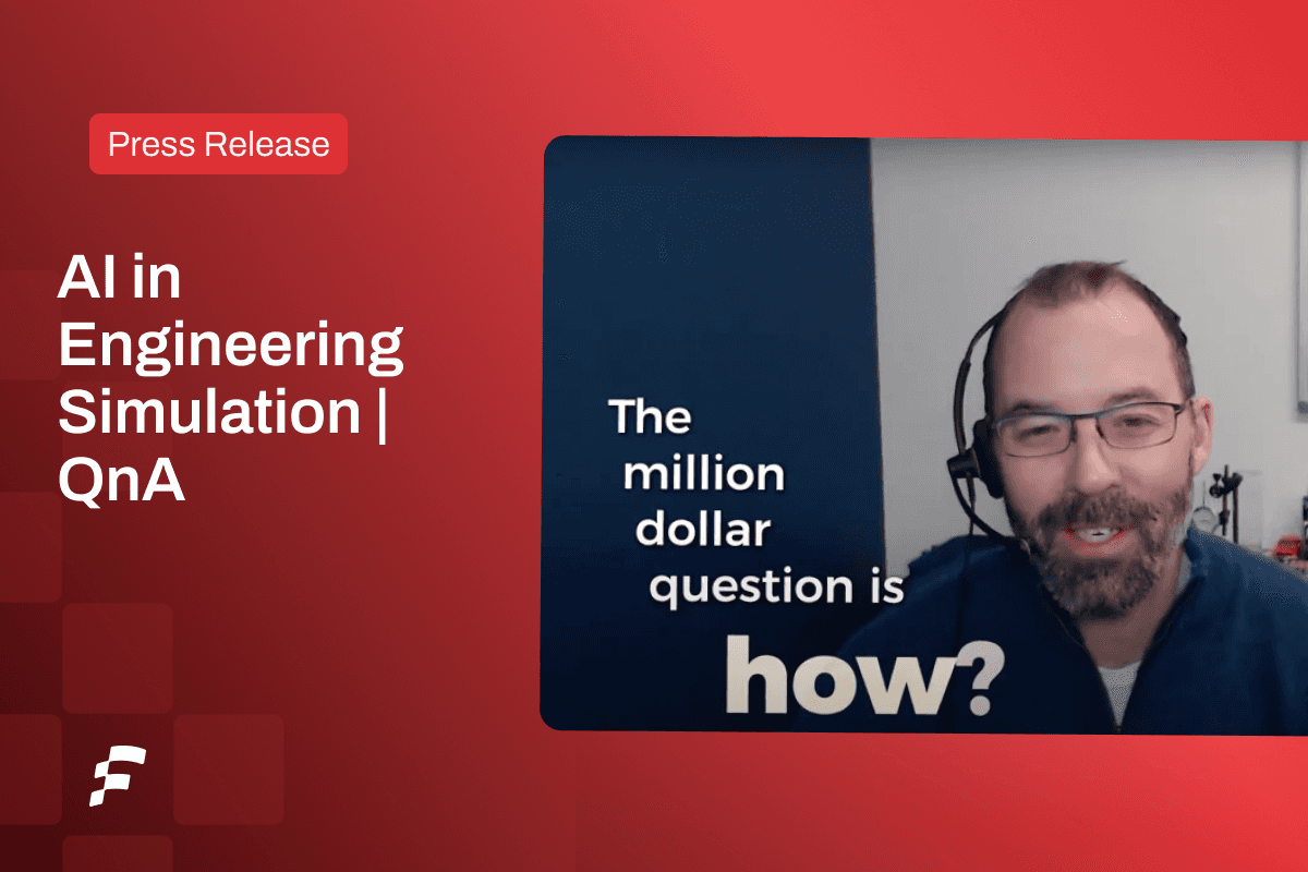 A man with a headset, smiling, sitting in front of a whiteboard, talking.