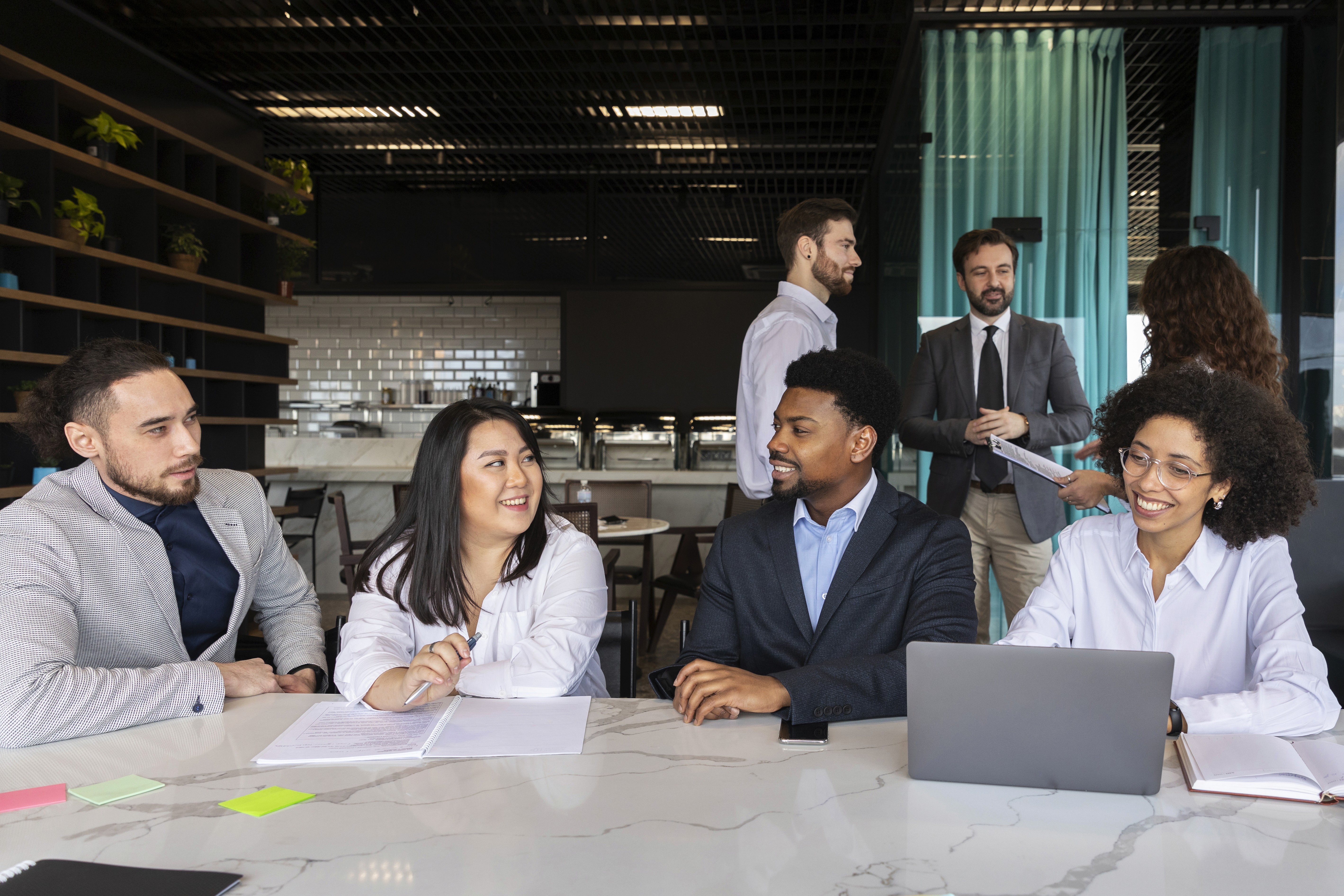 Diverse business team discusses strategic planning opportunities available with a JAFZA trade license.