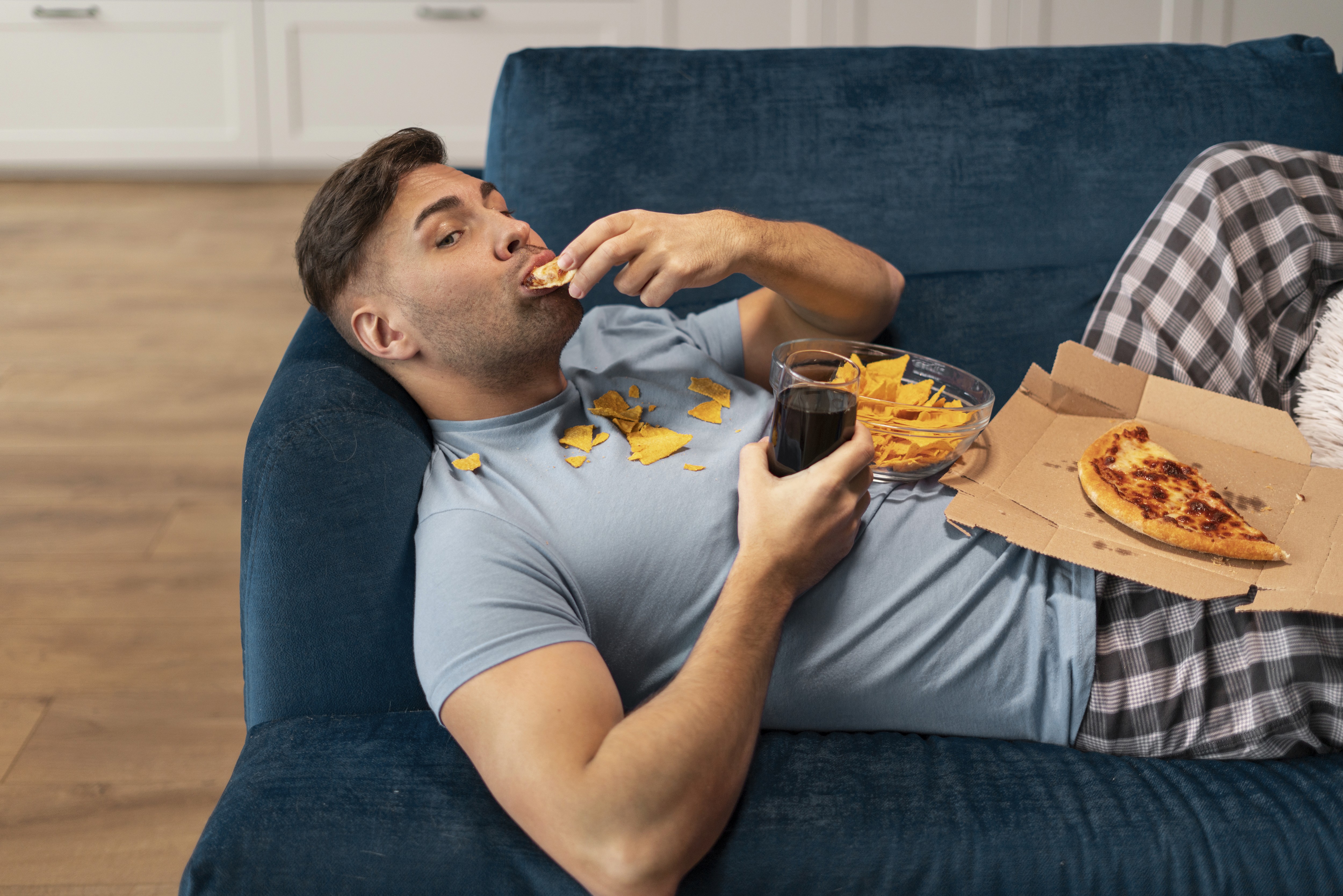 person eating junk food without keeping the balance and moderation