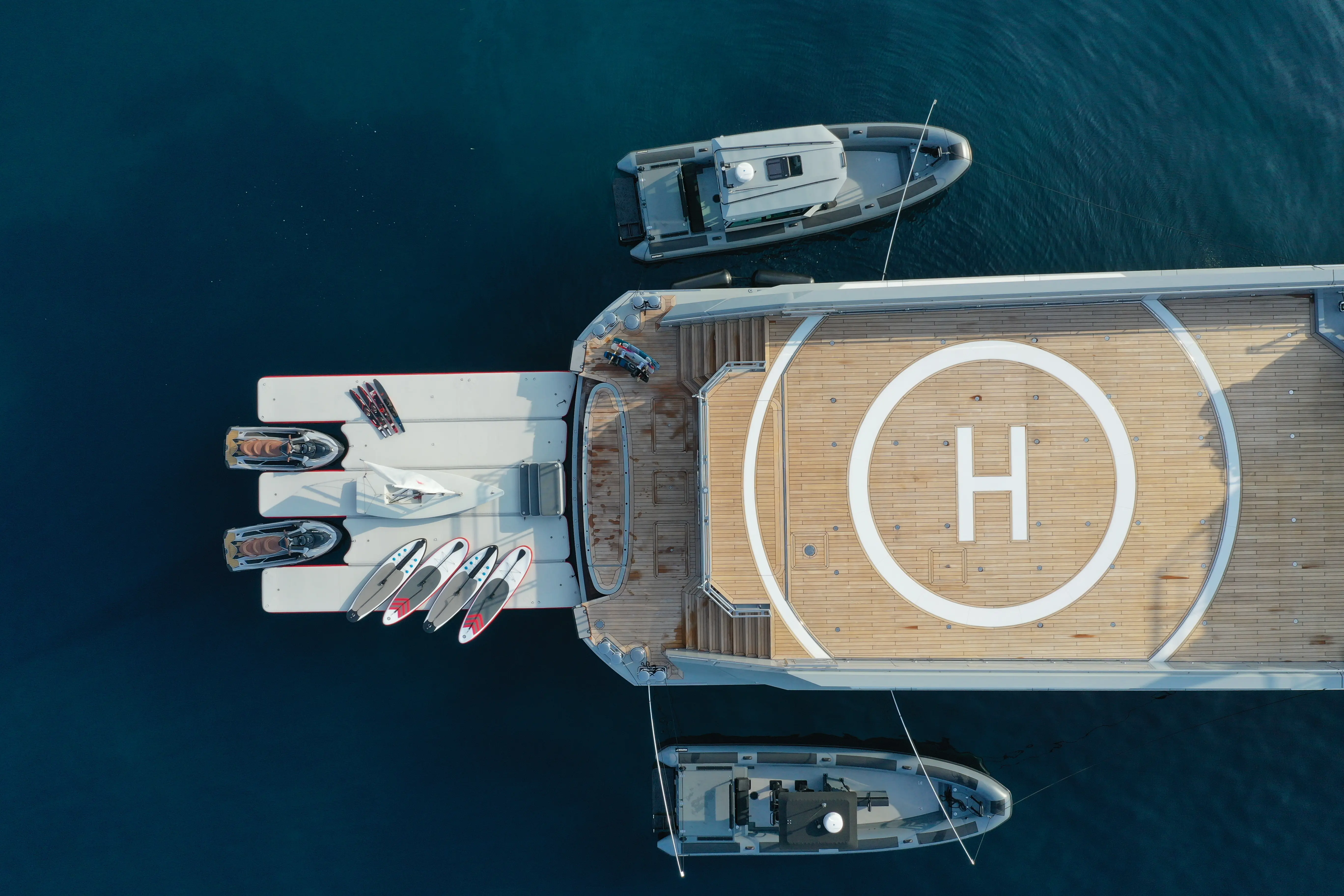 Bright farmhouse kitchen with wooden dining table centerpiece.