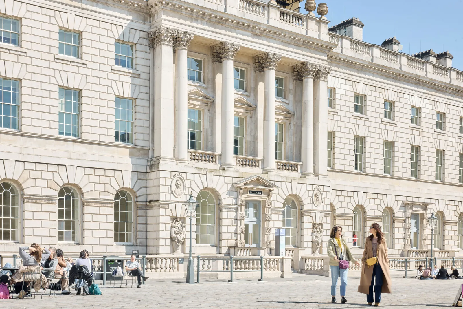 a blurry photo of a person standing in front of a wall