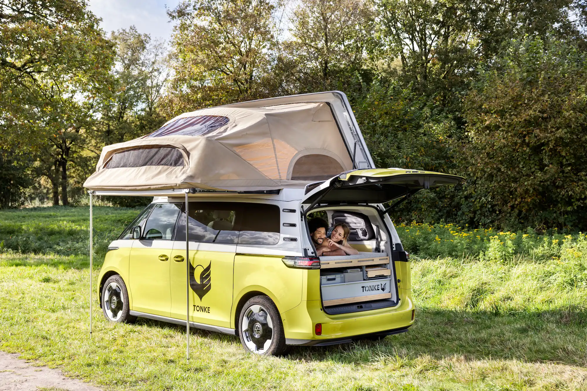 Camper van with an integrated textile pop-up roof