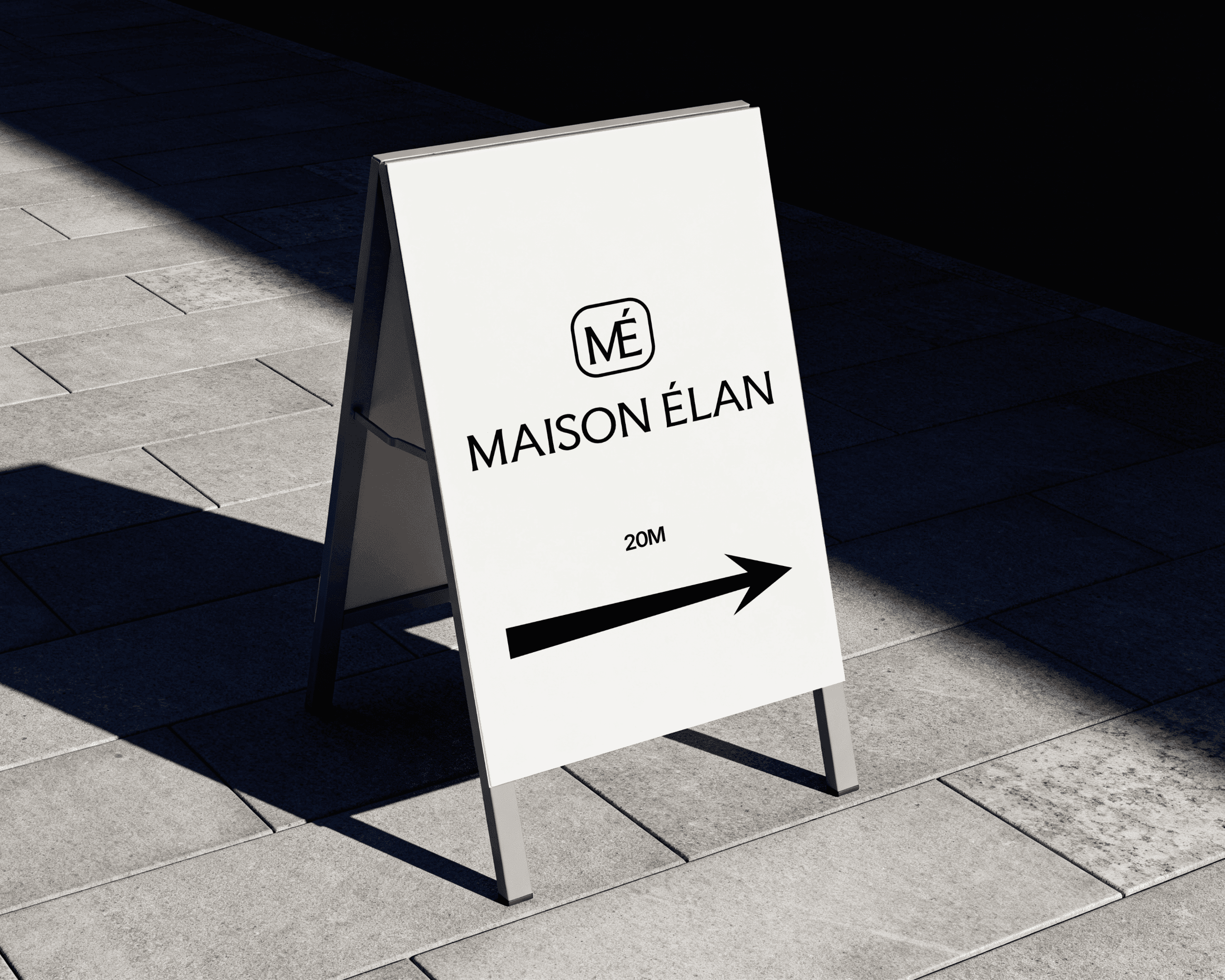 A sign for Maison Élan featuring the brand logo and an arrow pointing to the right.
