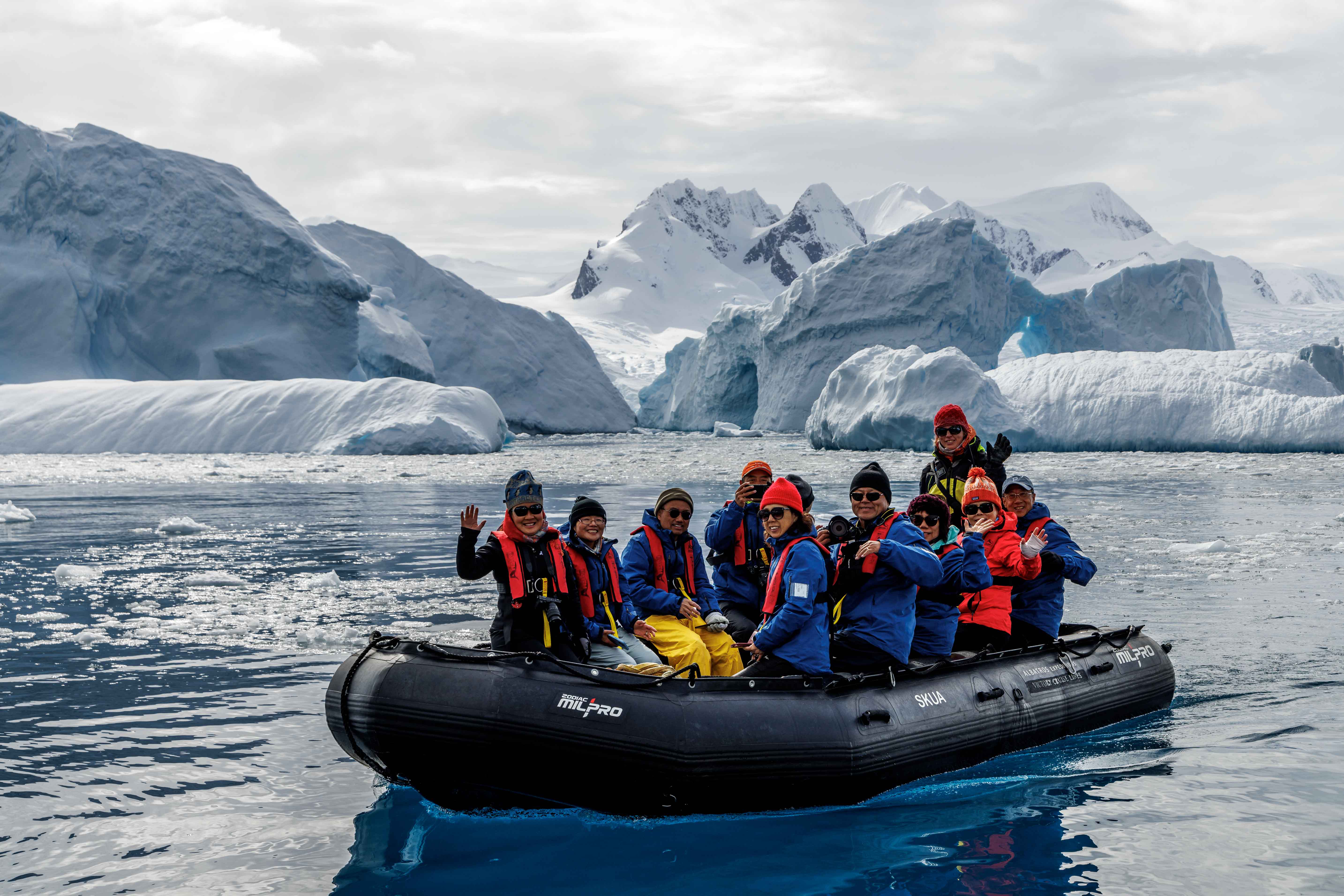 Zodiac with tourists exploring antarctica