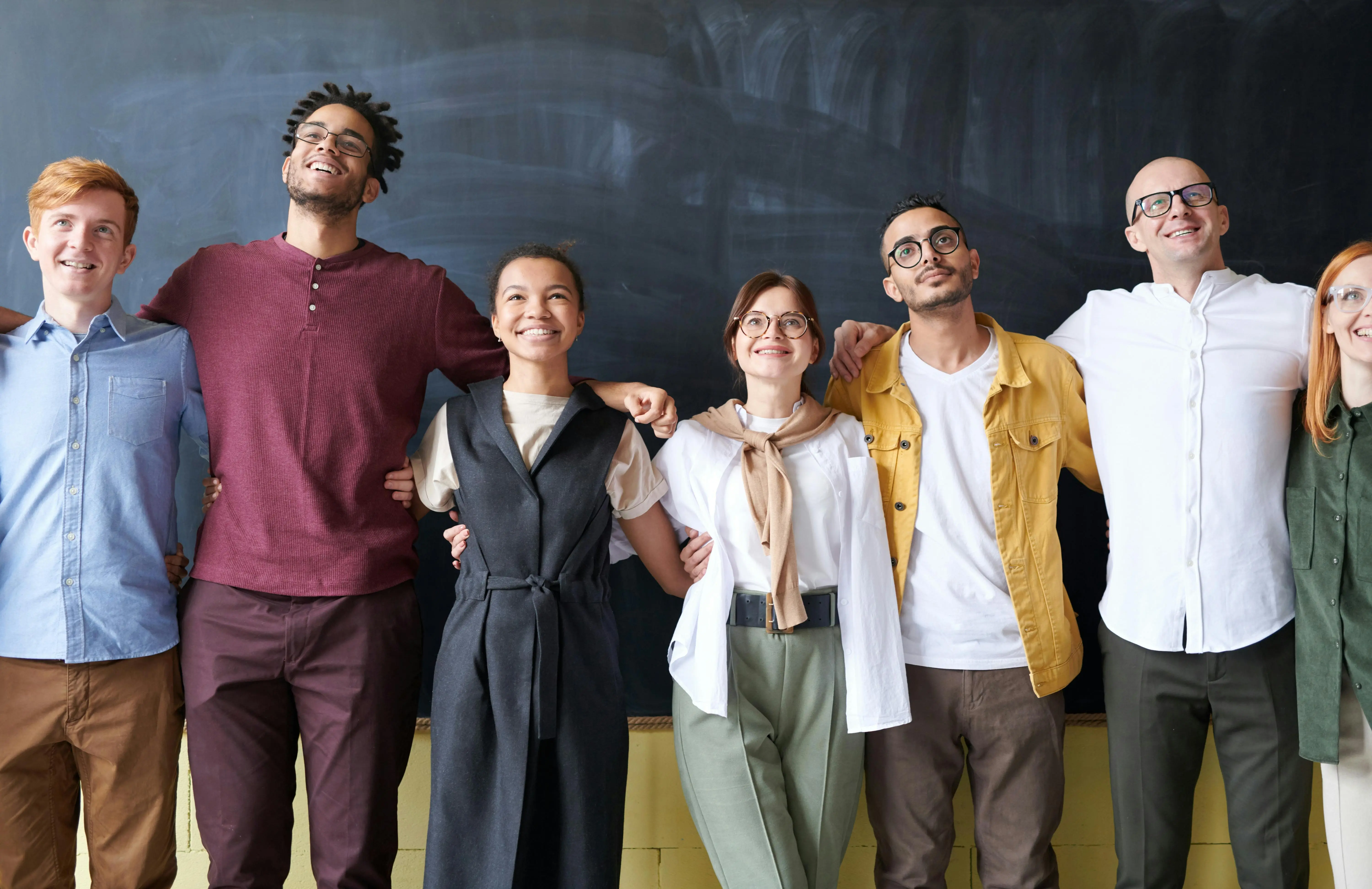 Multicultural group of high schoolers standing together—representing youth collaboration in global research and cross-cultural education projects.