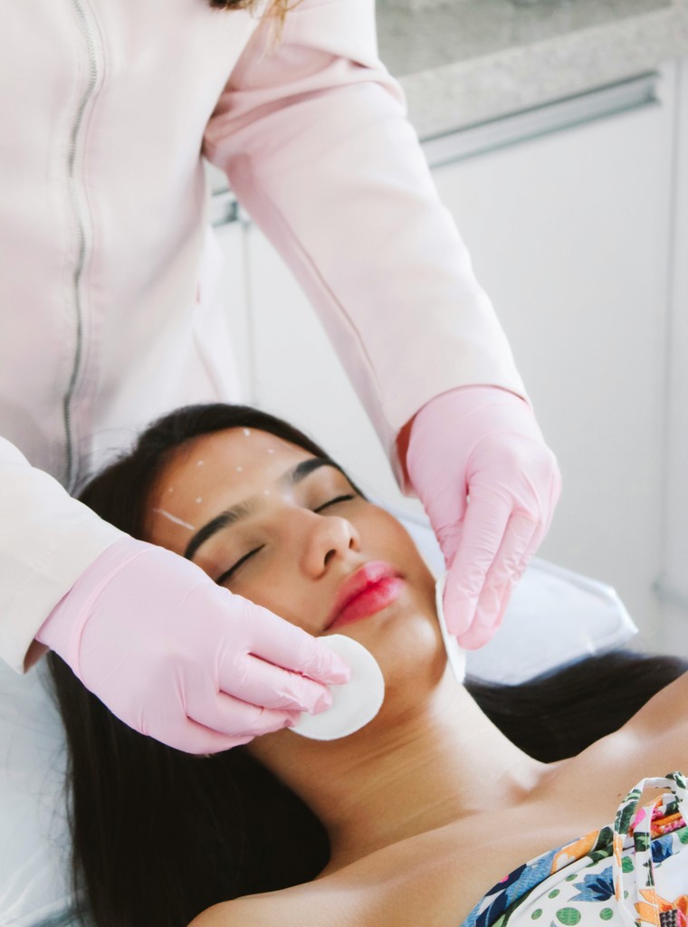 Patient's skin being gently cleansed and prepped with a pad before Botox injection at a medical spa in Delray Beach, Florida.