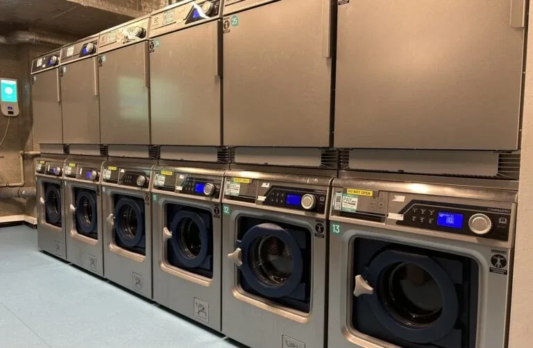 Modern laundry room available at student accommodation in Kraków