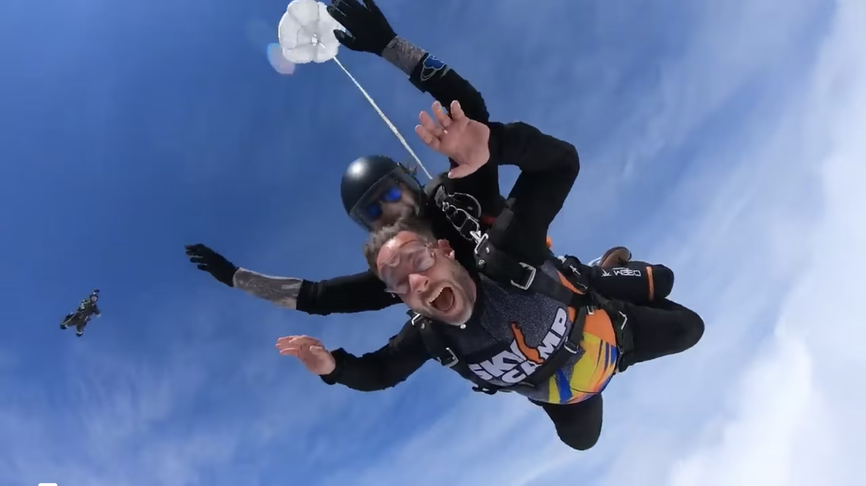 The thumbnail is of two men jumping out of an airplane