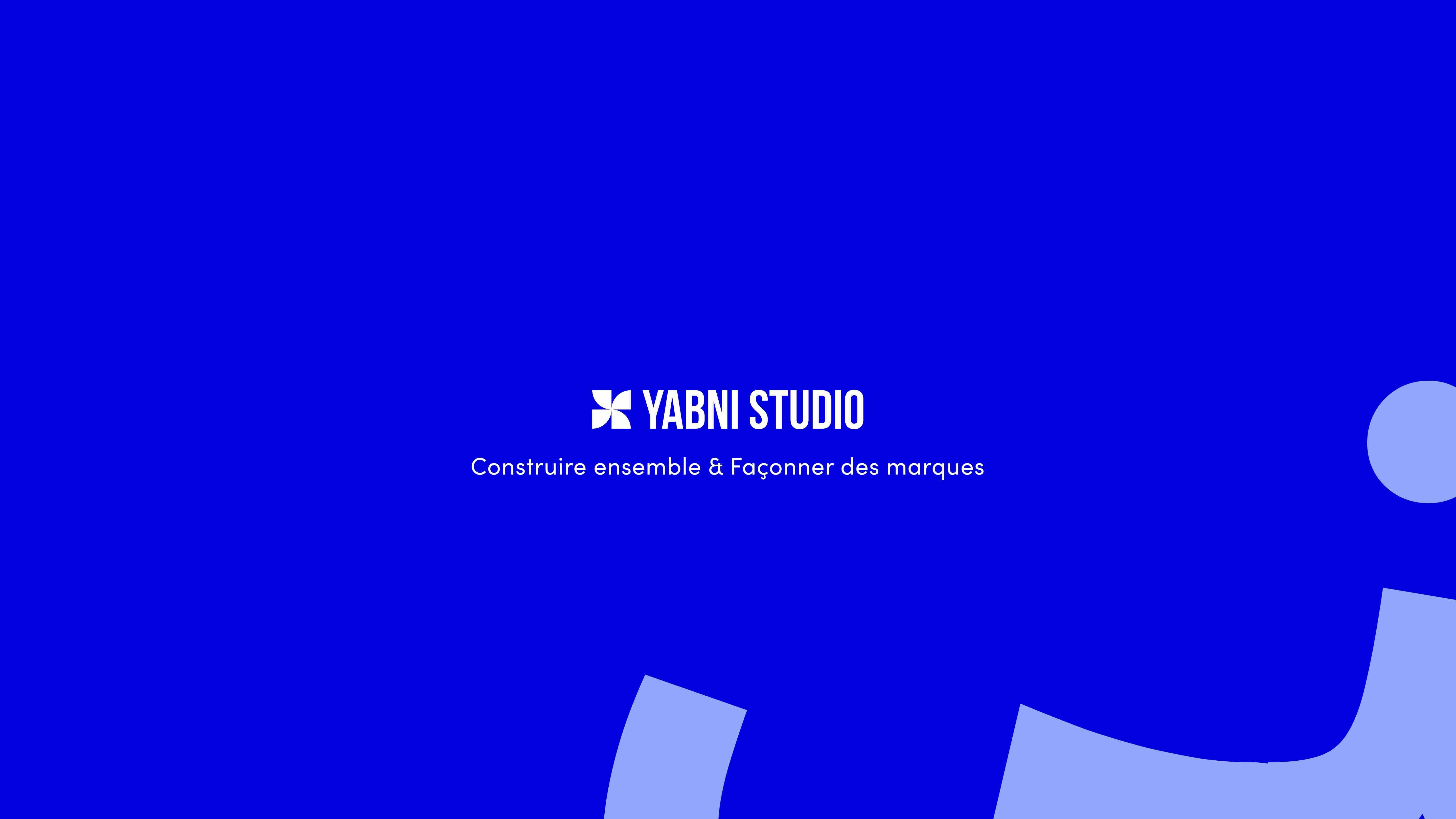 woman in black and white checkered long sleeve shirt sitting beside man in green crew neck