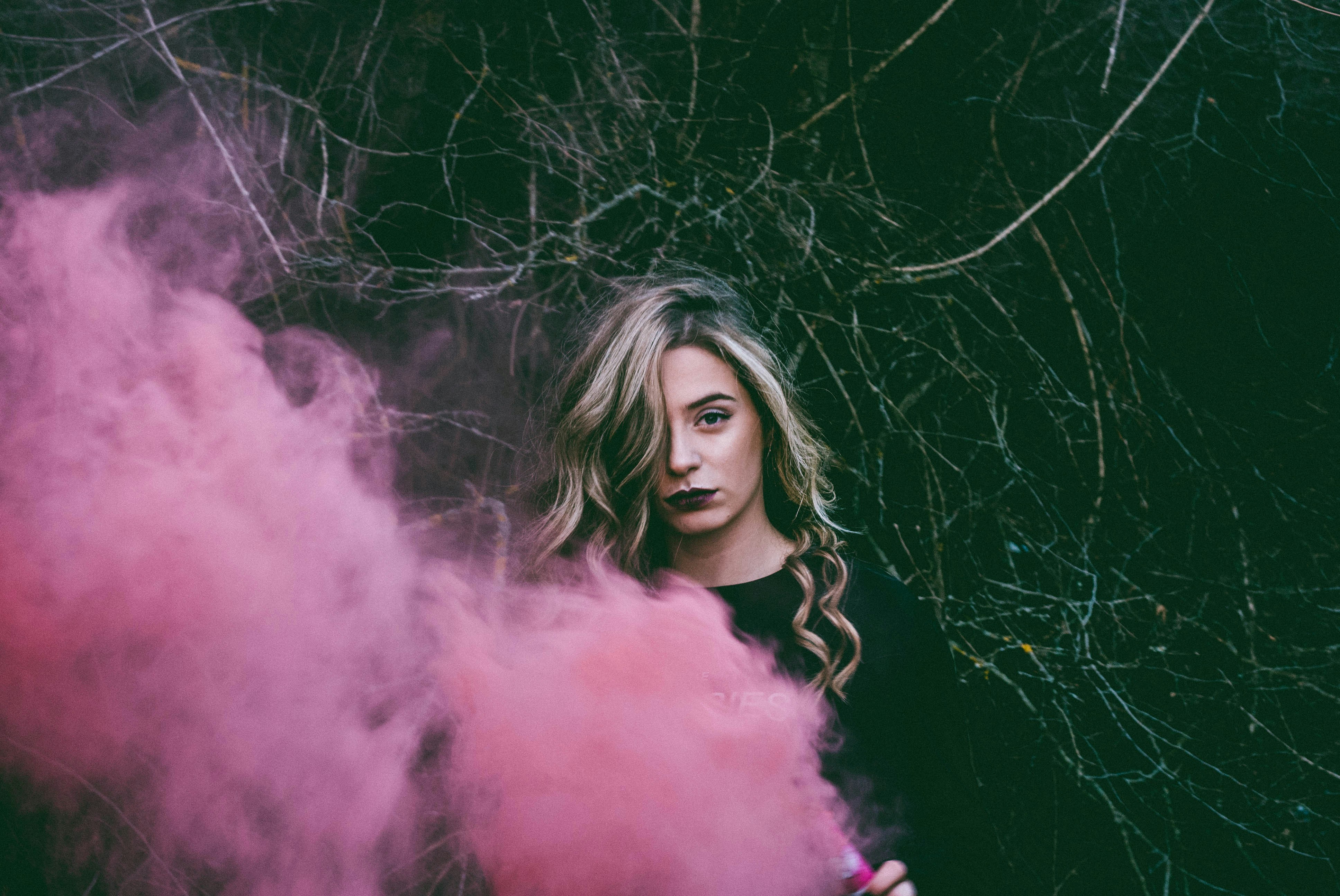 woman enjoying pink spray - What Colors Look Good on Pale Skin with Pink Undertones