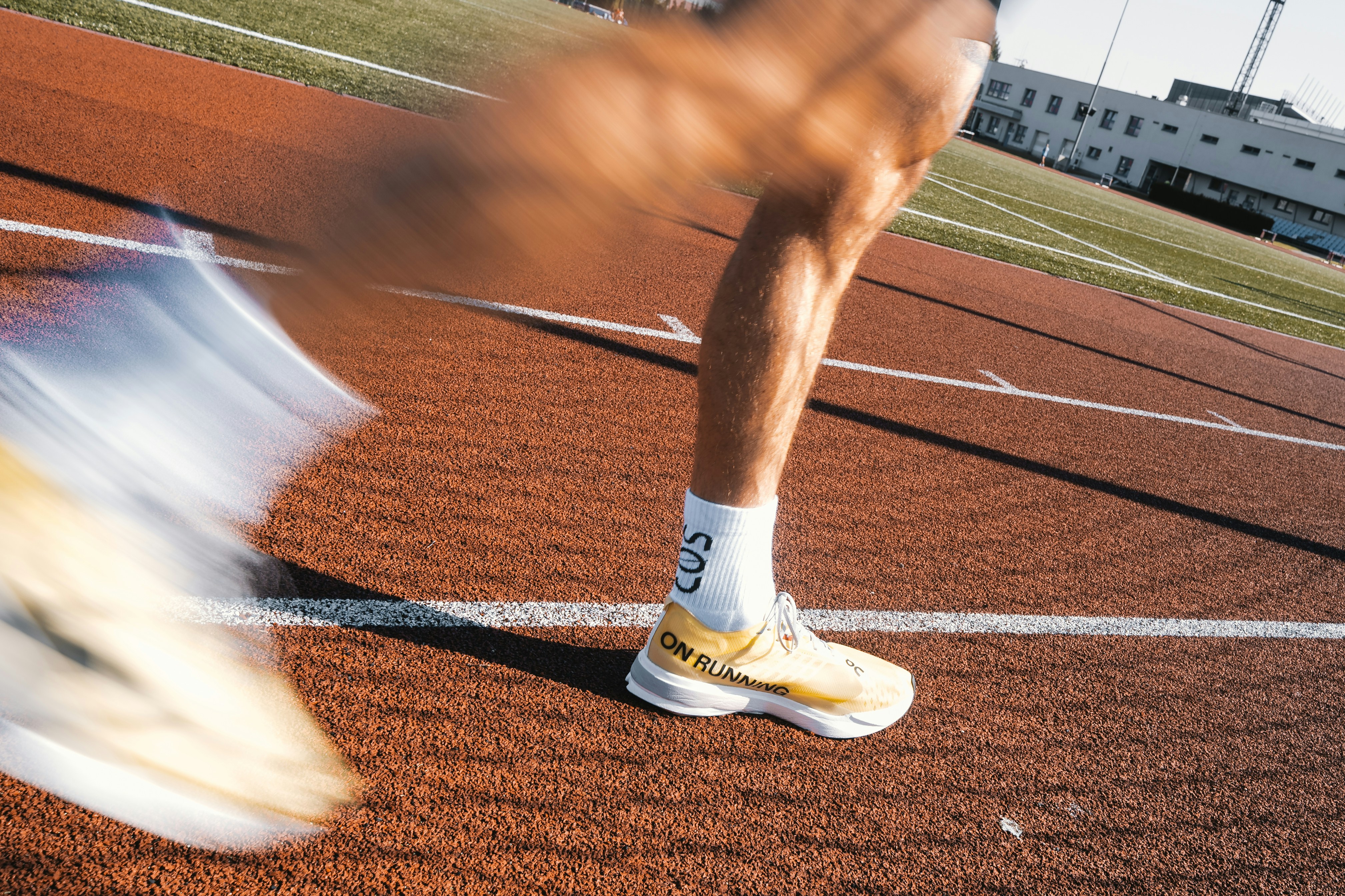 Runner's legs in motion on a track