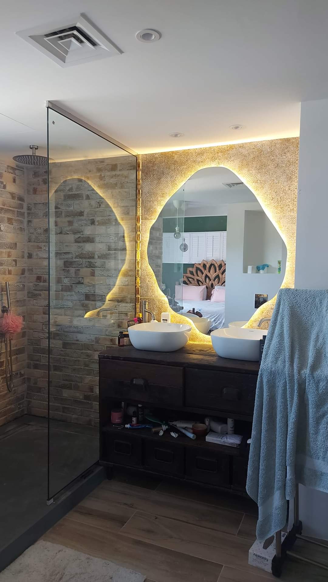 two people looking at a tablet and smiling