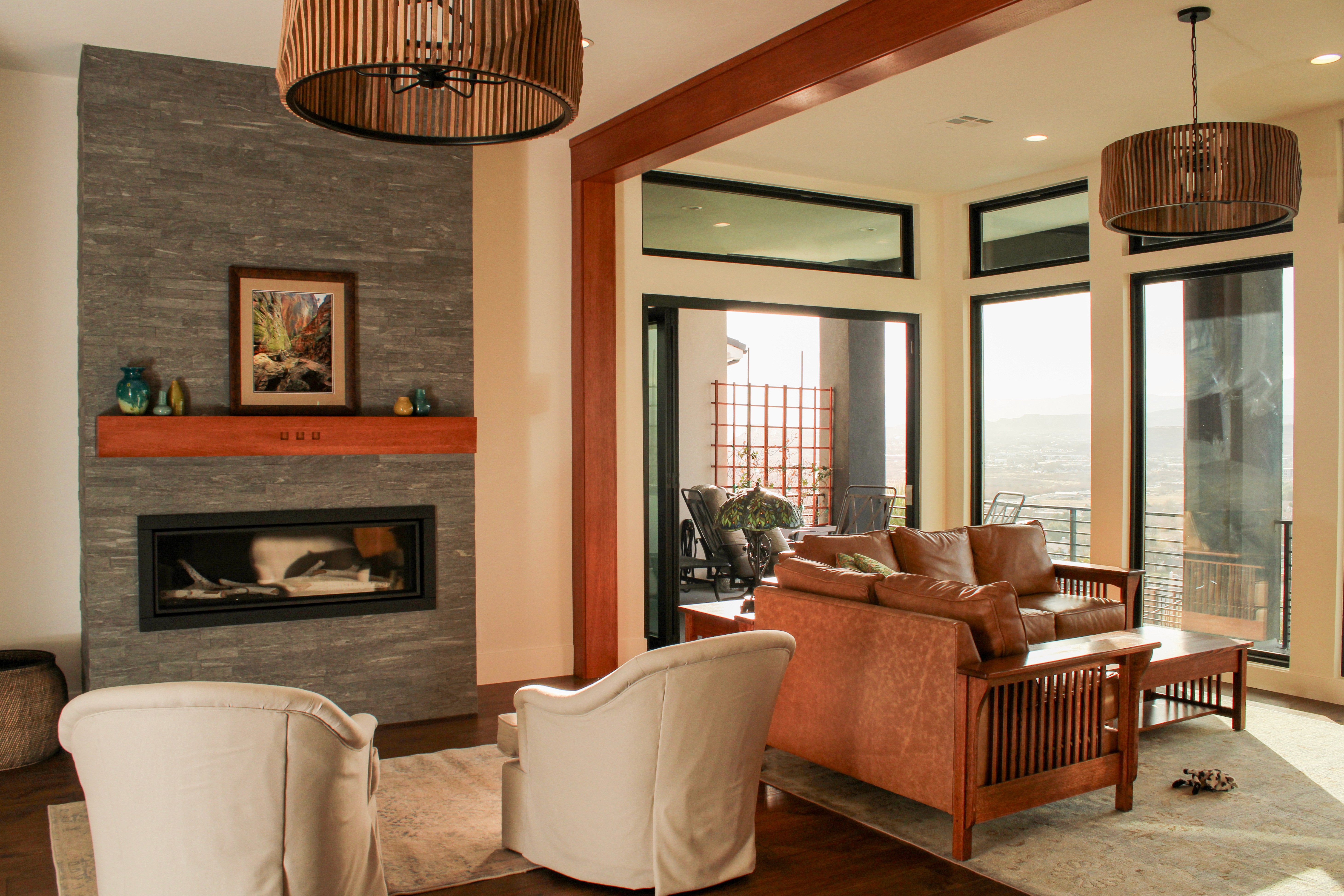 Great room in a St. George, Utah home featuring 70s-style wood accents, fireplace, and warm, inviting design