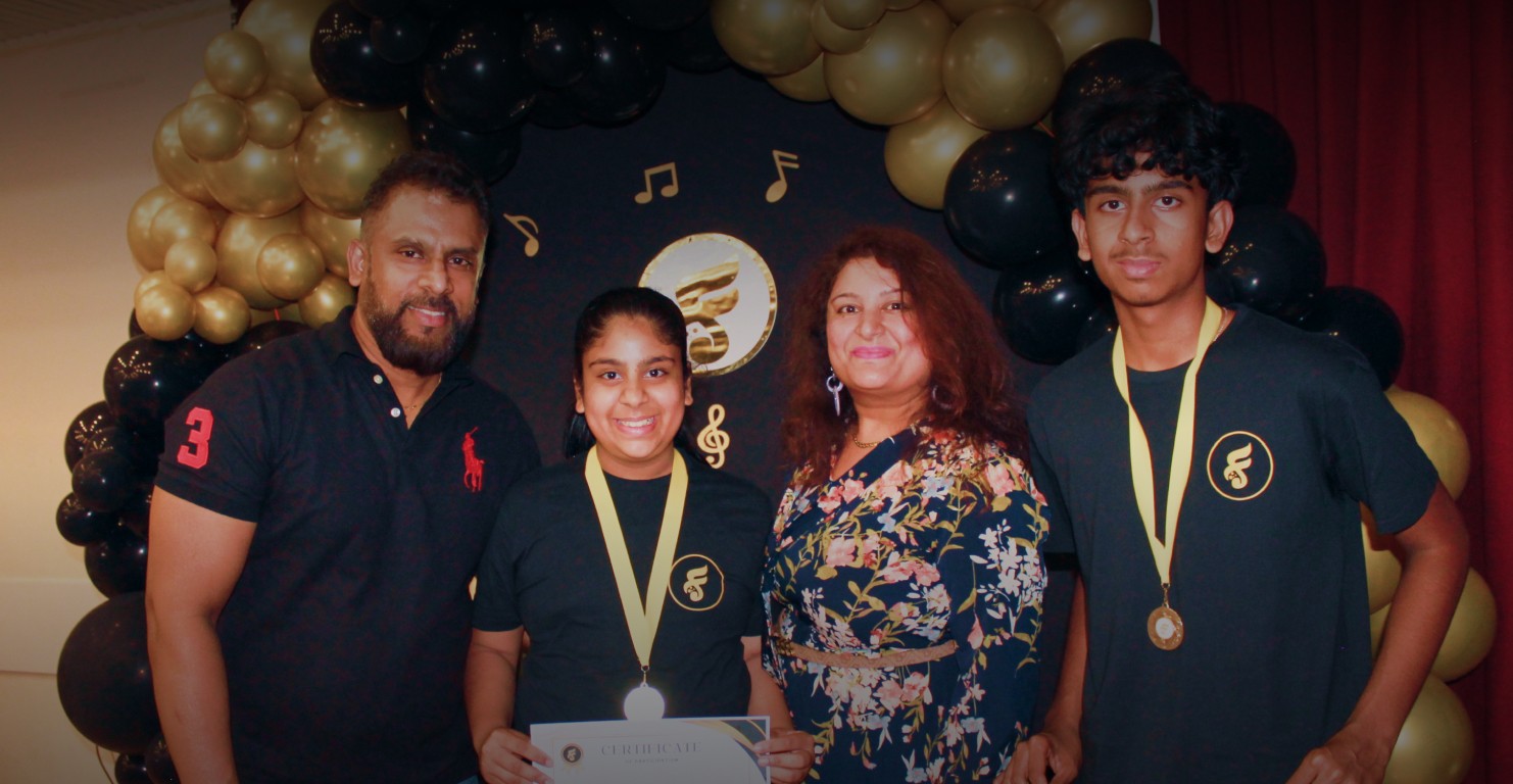 Students with Parents photograph after the performance receiving their awards