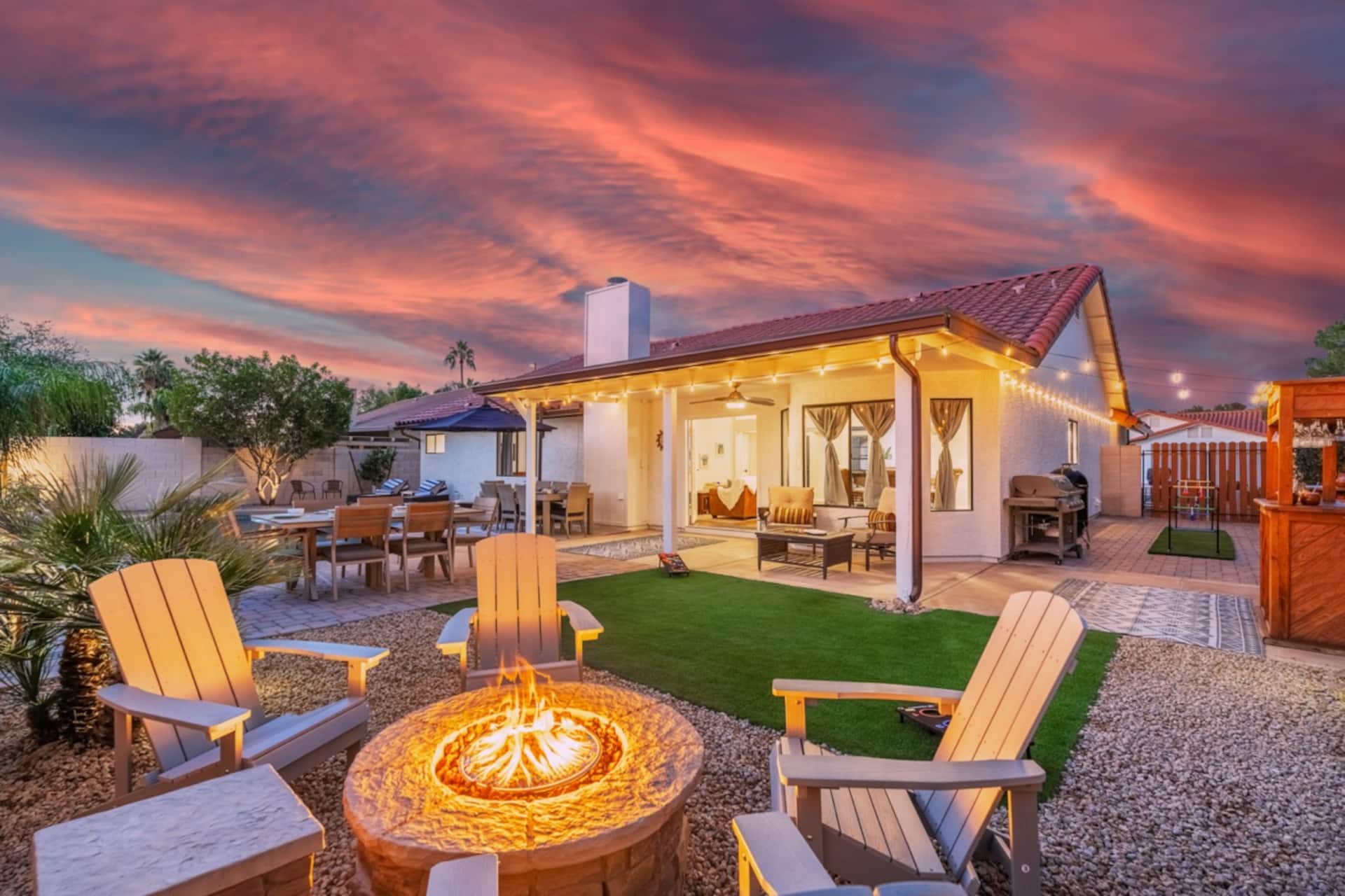 Experience the magic of our backyard haven - a fire pit for enchanting nights and a generous seating area for gathering, celebrating, or simply absorbing the serenity.