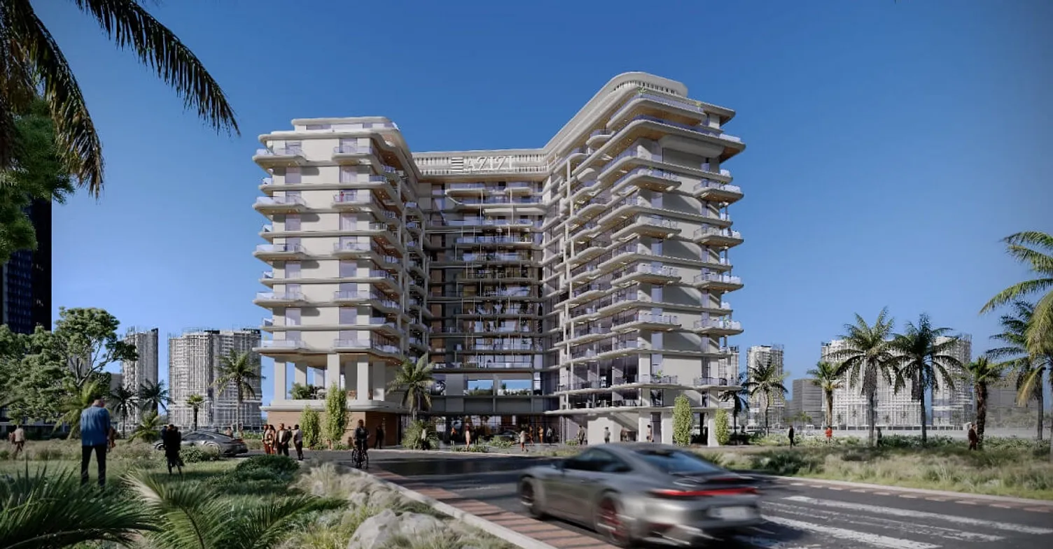 Street-level view of Azizi Wasel residential tower in Dubai, with landscaped surroundings, palm trees, and modern architecture.