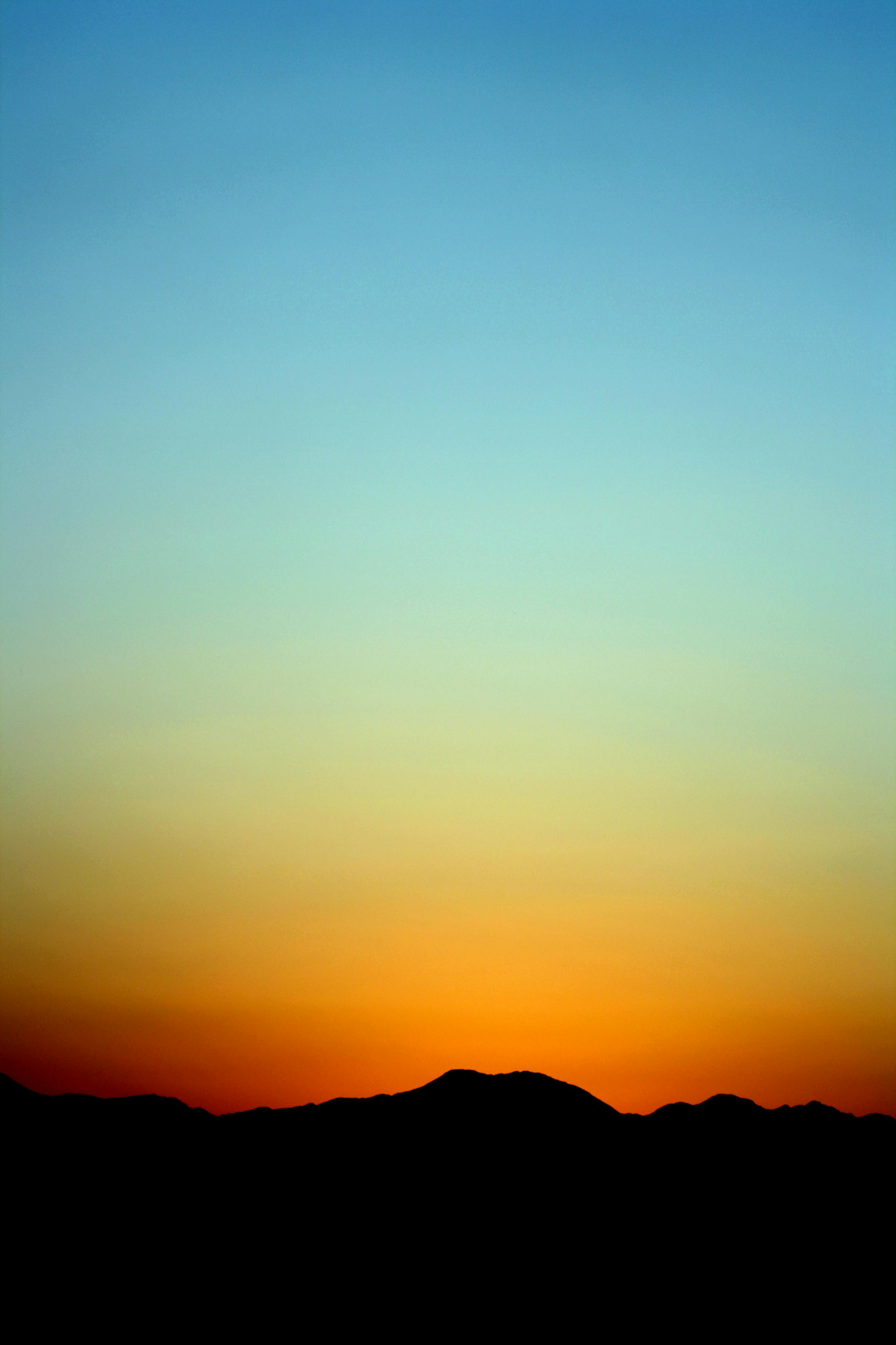 Photo by David McEachan: https://www.pexels.com/photo/silhouette-of-mountain-under-orange-and-blue-sky-during-sunset-92664/