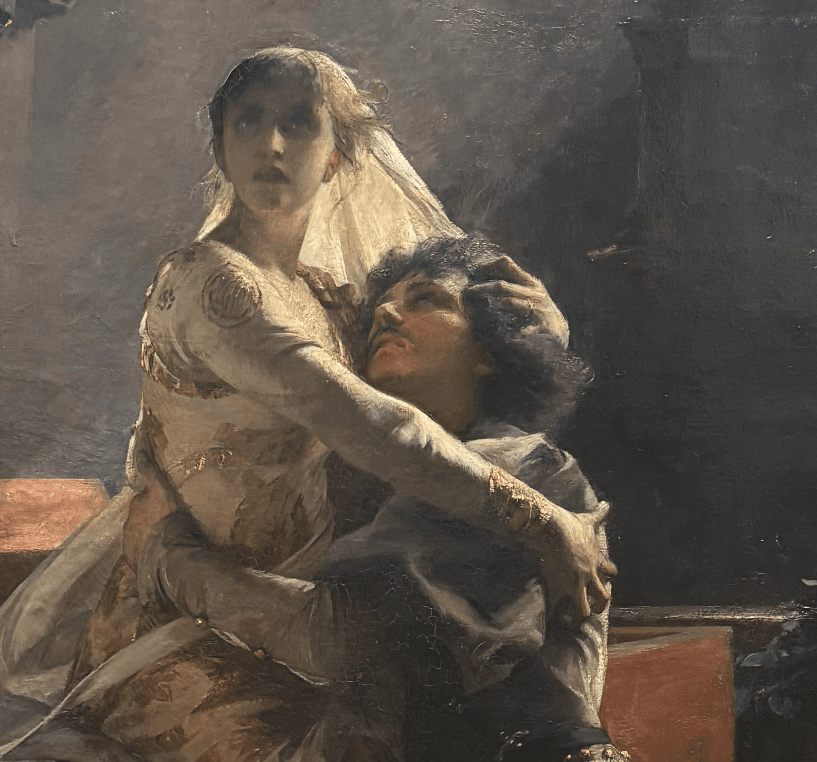 Vue de proche du tableau "Le Réveil de Juliette" d'Albert Maignan (1887), huile sur toile, 227 x 177 cm, dans son cadre doré sculpté, Musée des Beaux-Arts de Lyon. Juliette en robe blanche se réveille dans les bras de Roméo mourant, dans un décor de caveau sombre aux tons ocres et gris.
