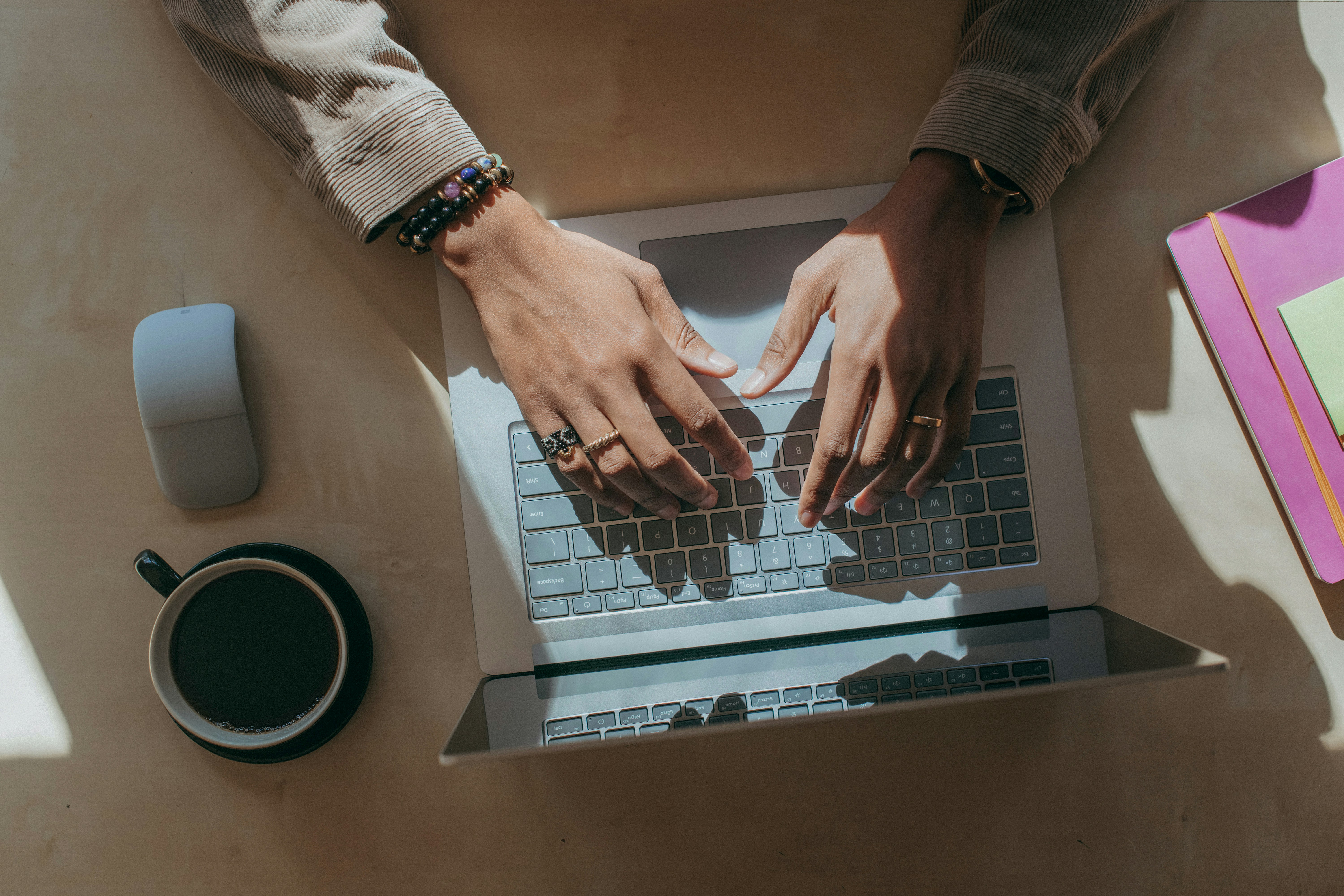 woman typing her First Person Essay