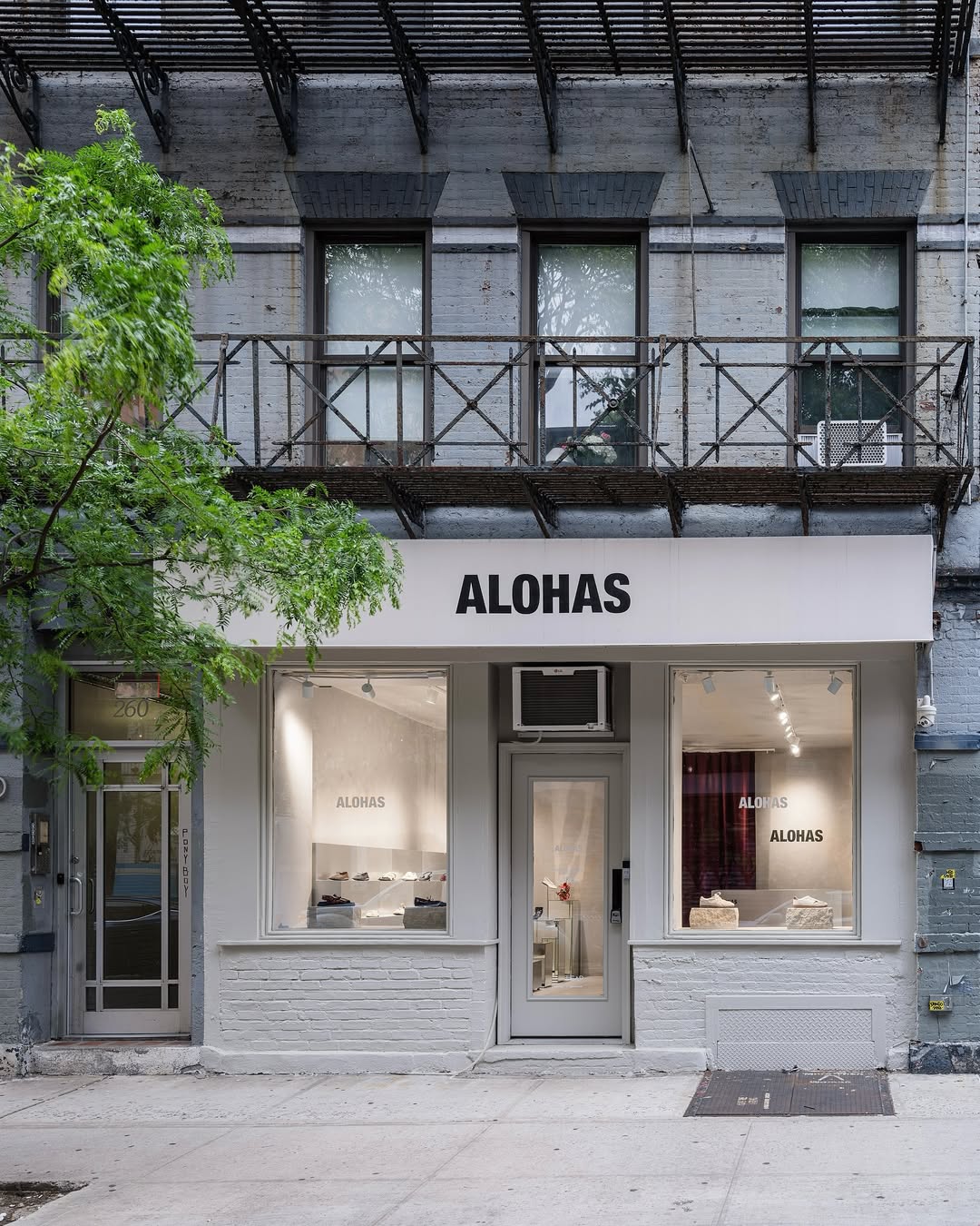Custom Alohas storefront signage on the exterior of the New York retail store.