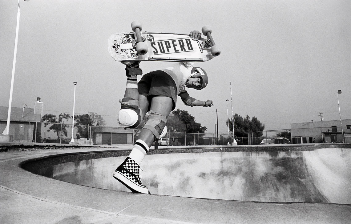 Old school skateboarder doing a foot plant with SPRB deck