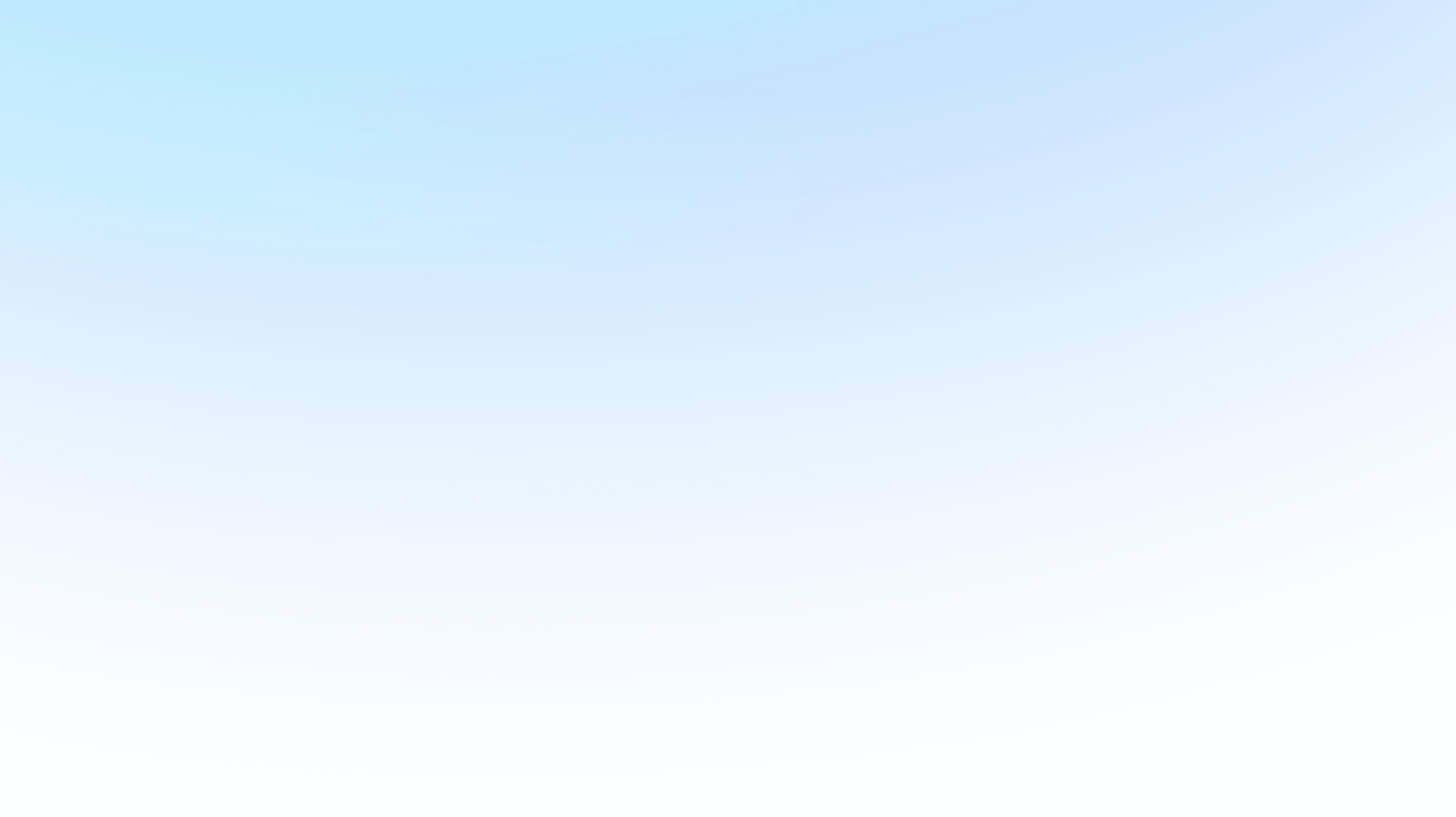 A clear blue sky with a few faint clouds scattered across. Bright and serene atmosphere.