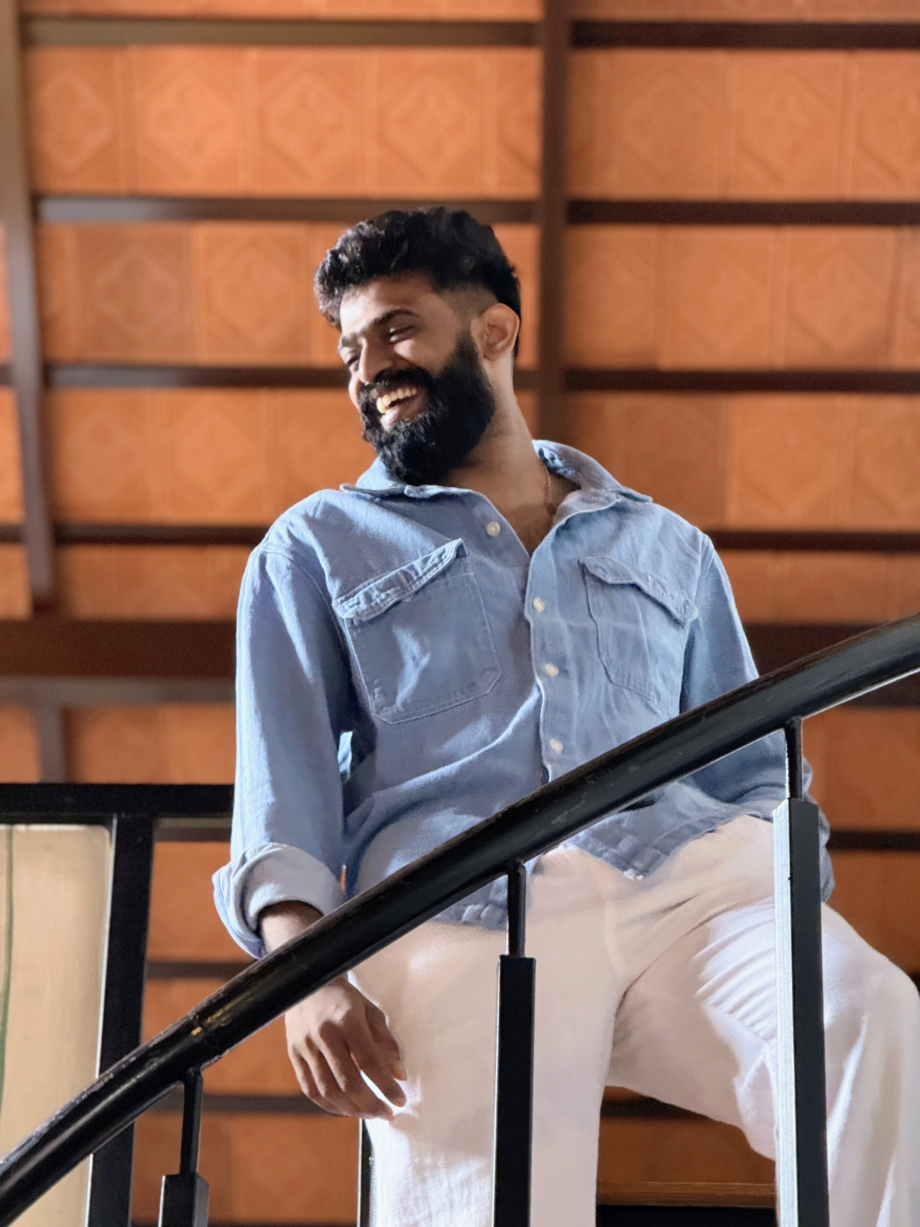 Man reading a book at a train station