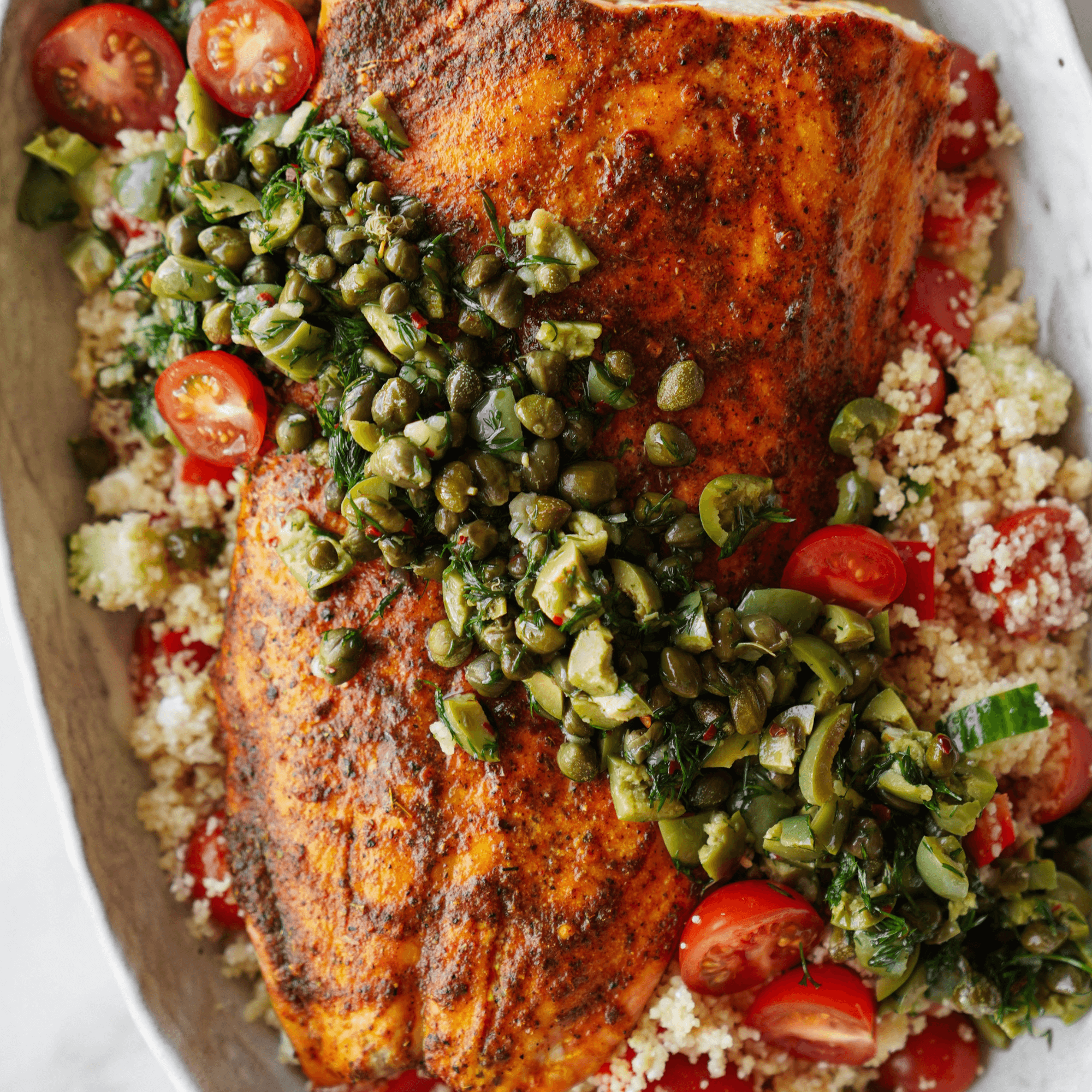 Mediterranean salmon with tomatoes, olives, and herbs
