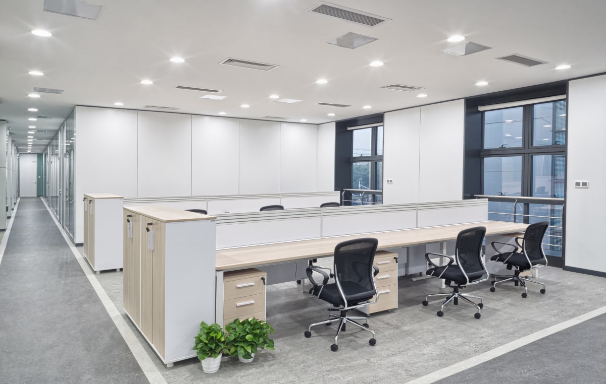 Modern open-plan office interior available for lease in a prestigious real estate development.