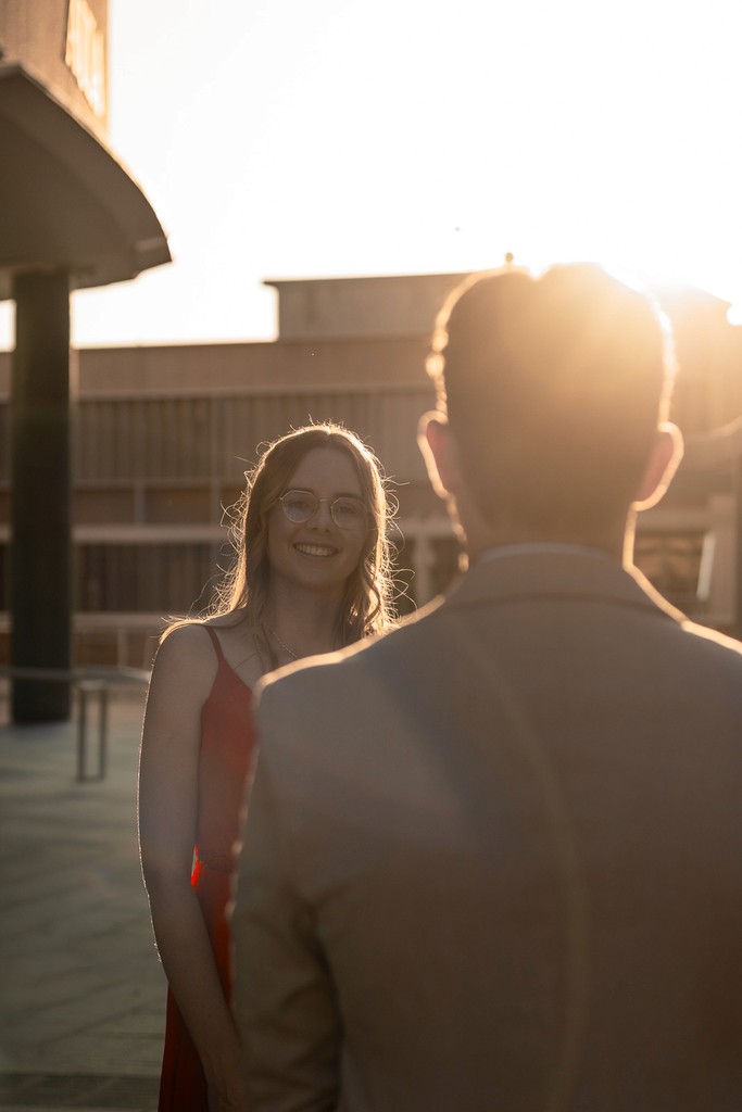 Portrait of friends laughing under golden hour