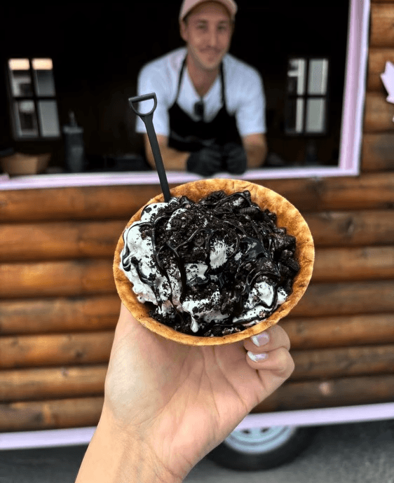 Waffle bowl filled with cookies & cream ice cream topped with chocolate creme cookie crumbles