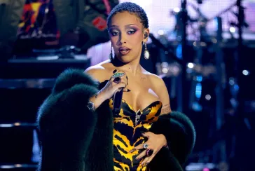 Doja Cat performing in tiger print dress.