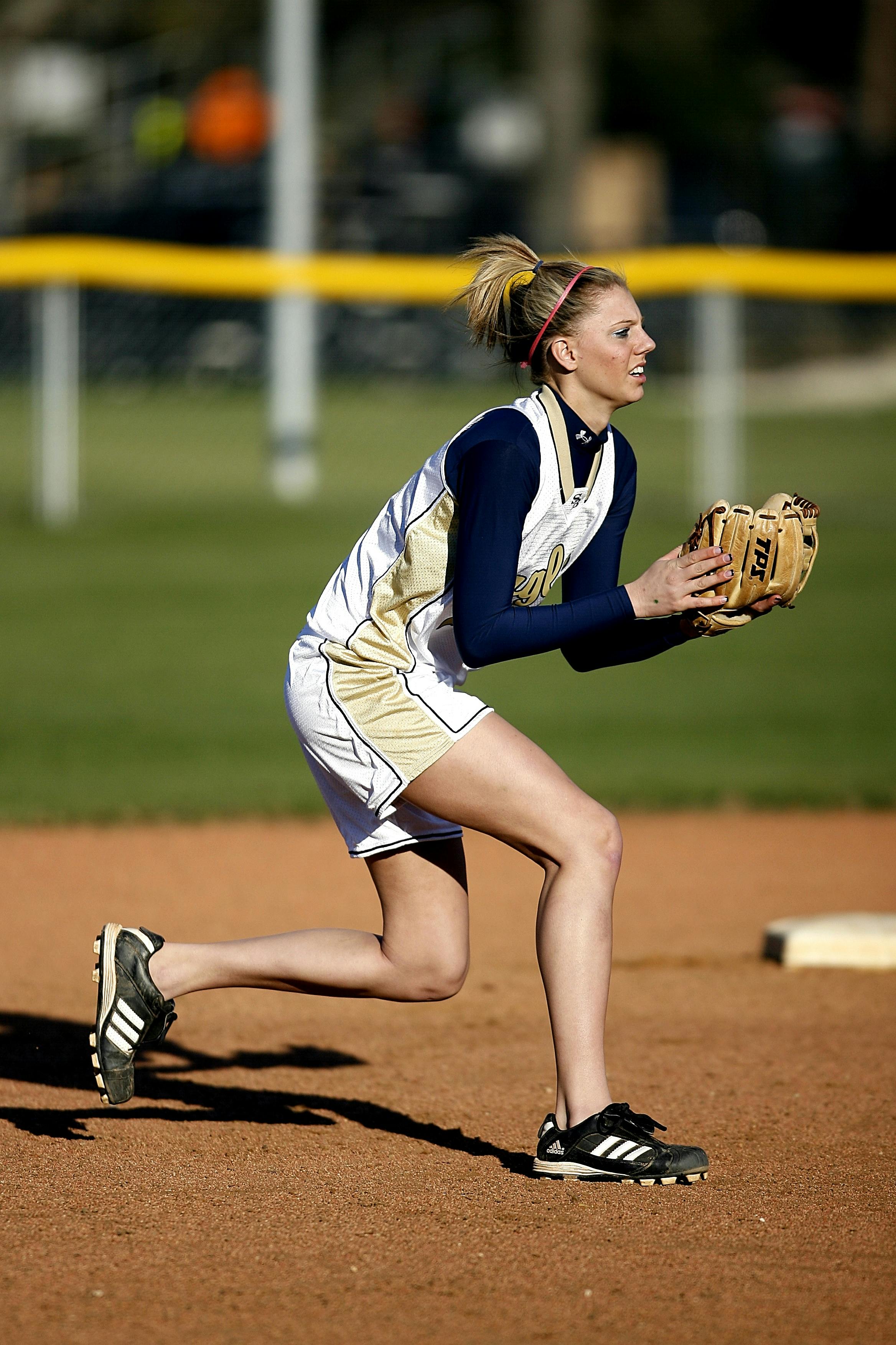College age White female playing softball