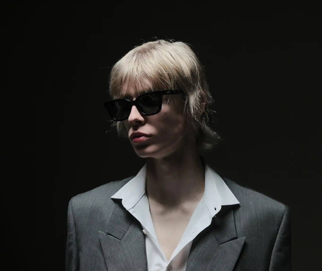 Stack of books with modern publishing design placed on bright white stairs