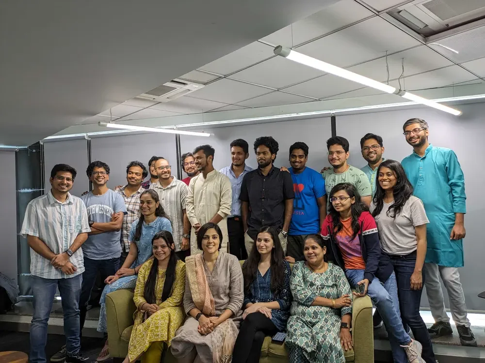 The team in traditional dress at a festive meetup