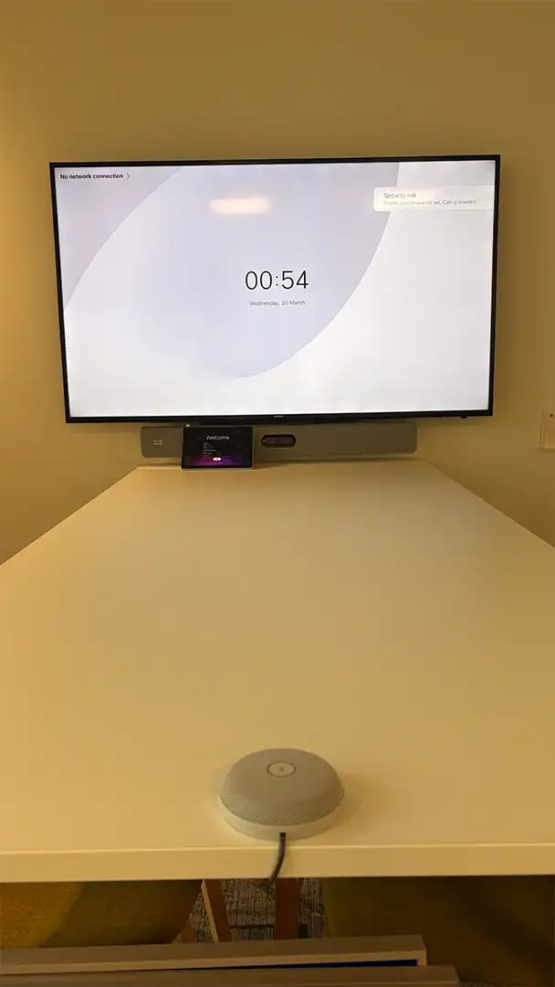 Small meeting room with display and video conferencing equipment