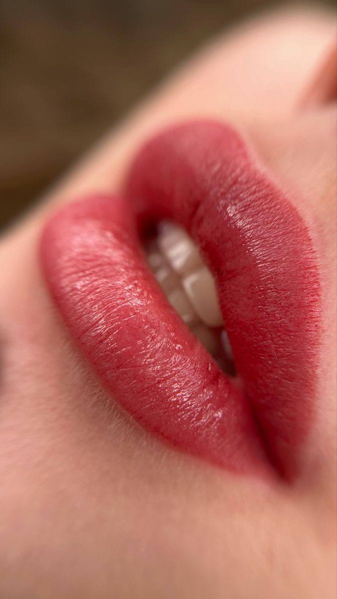 Crop view of female lips, after the procedure